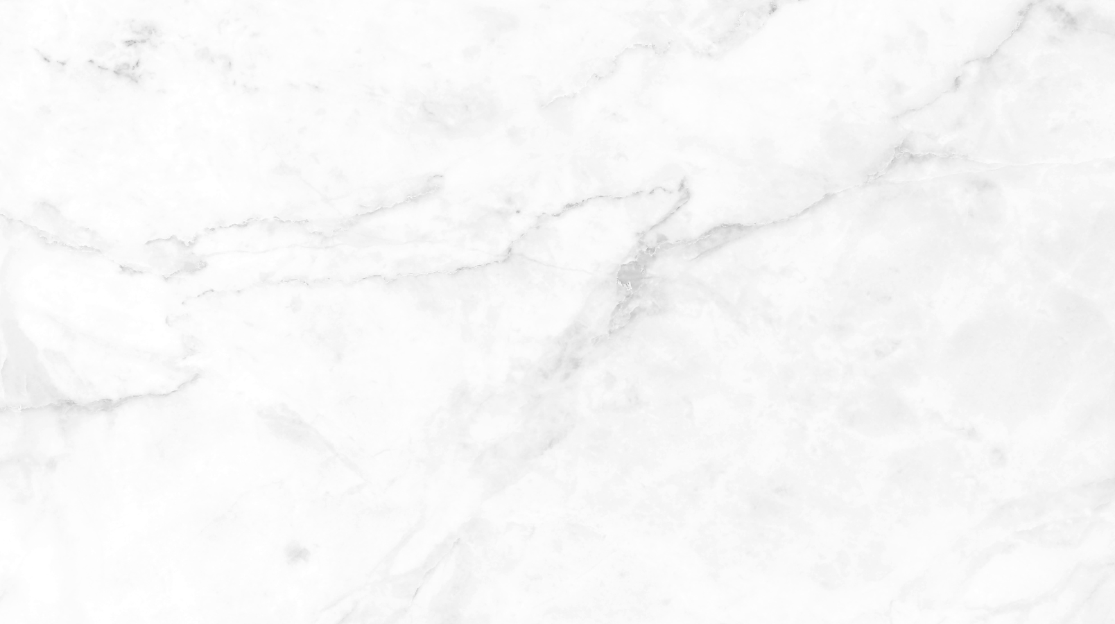 White marble surface with grey veining.