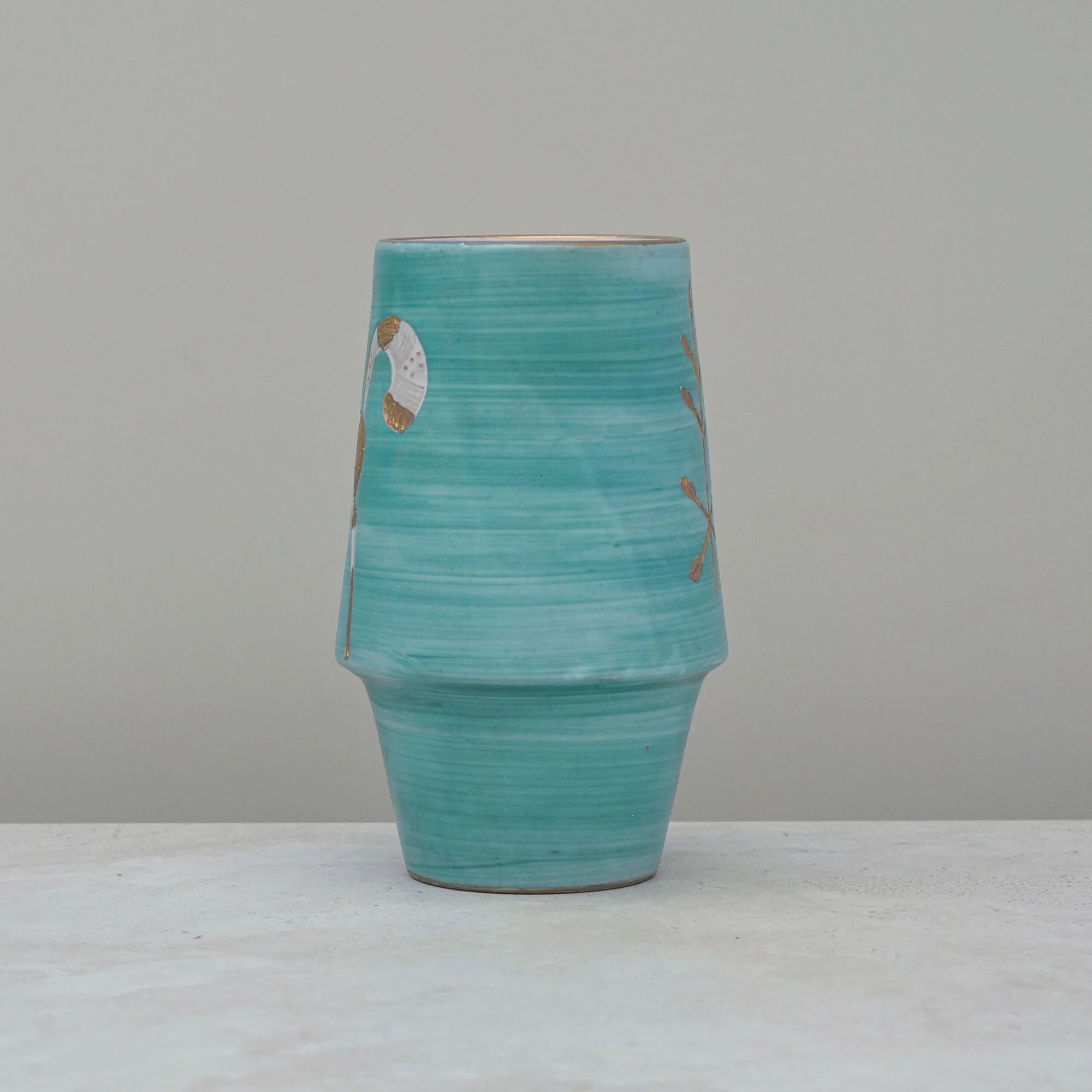 Side view of the aqua green Italian vase displaying its wheel-thrown form and soft hand-painted detailing.