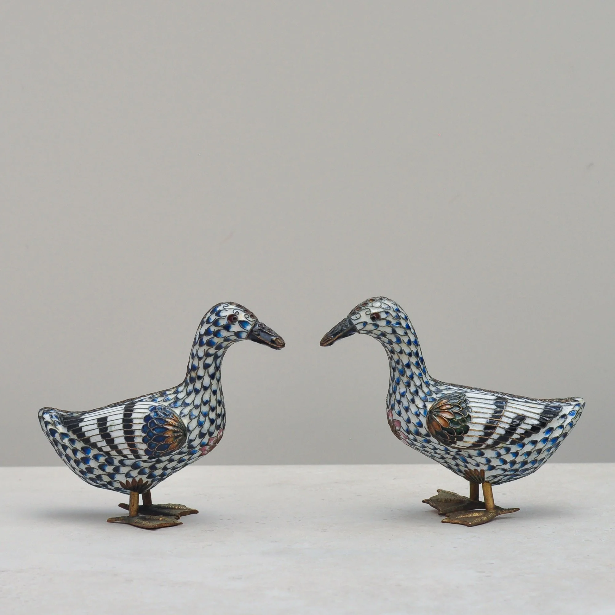 Mid-century cloisonné duck pair made from brass and coloured enamel – front view.