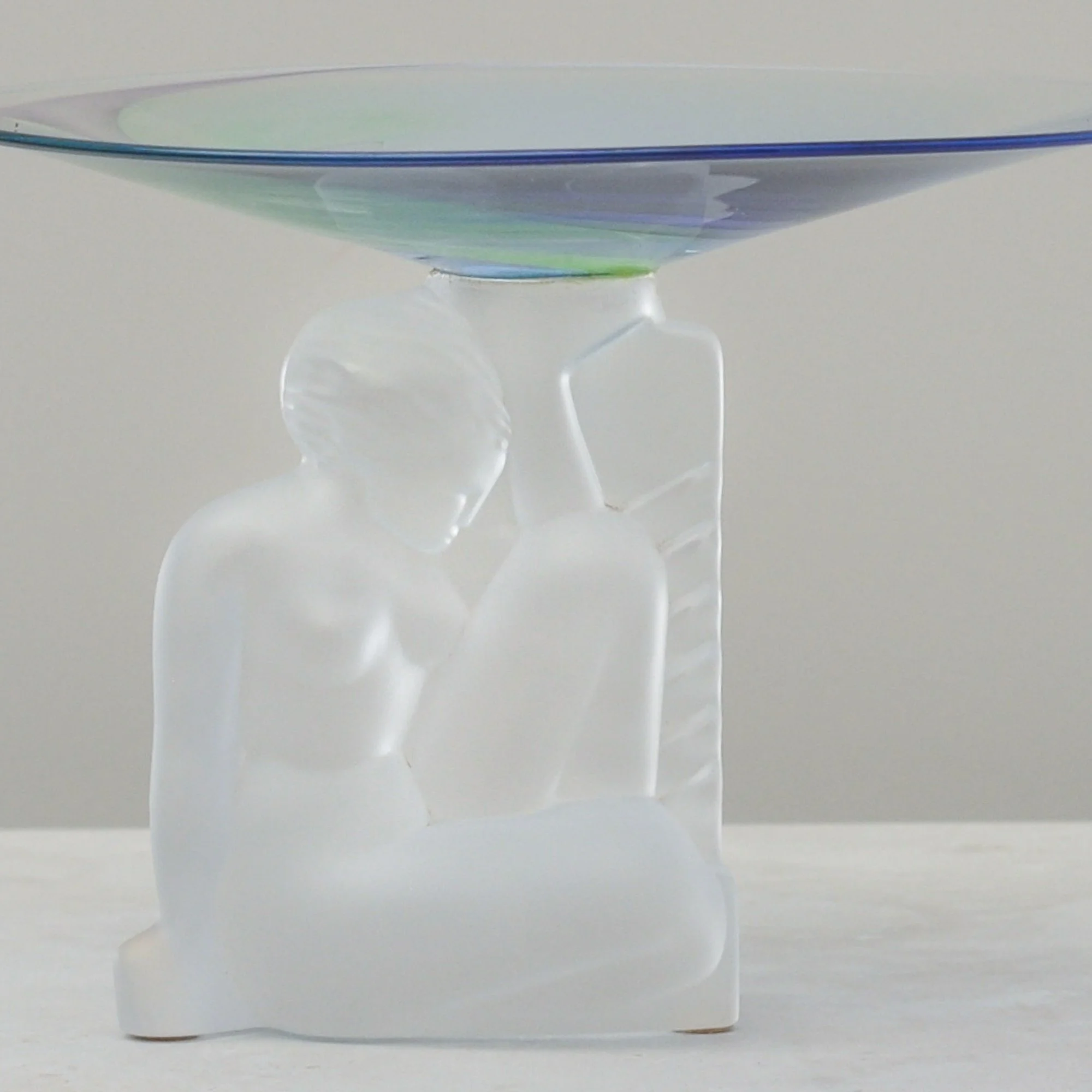 Front view of the Cristal de Sèvres pedestal dish showing the sculptural frosted lady figure and iridescent crystal bowl.