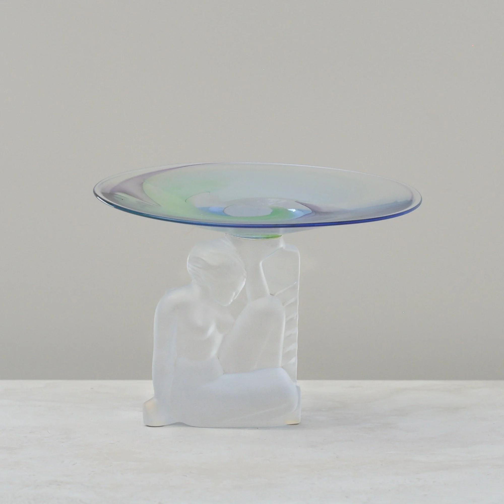 Cristal de Sèvres pedestal dish with frosted lady figure and swirled green and lavender glass bowl.