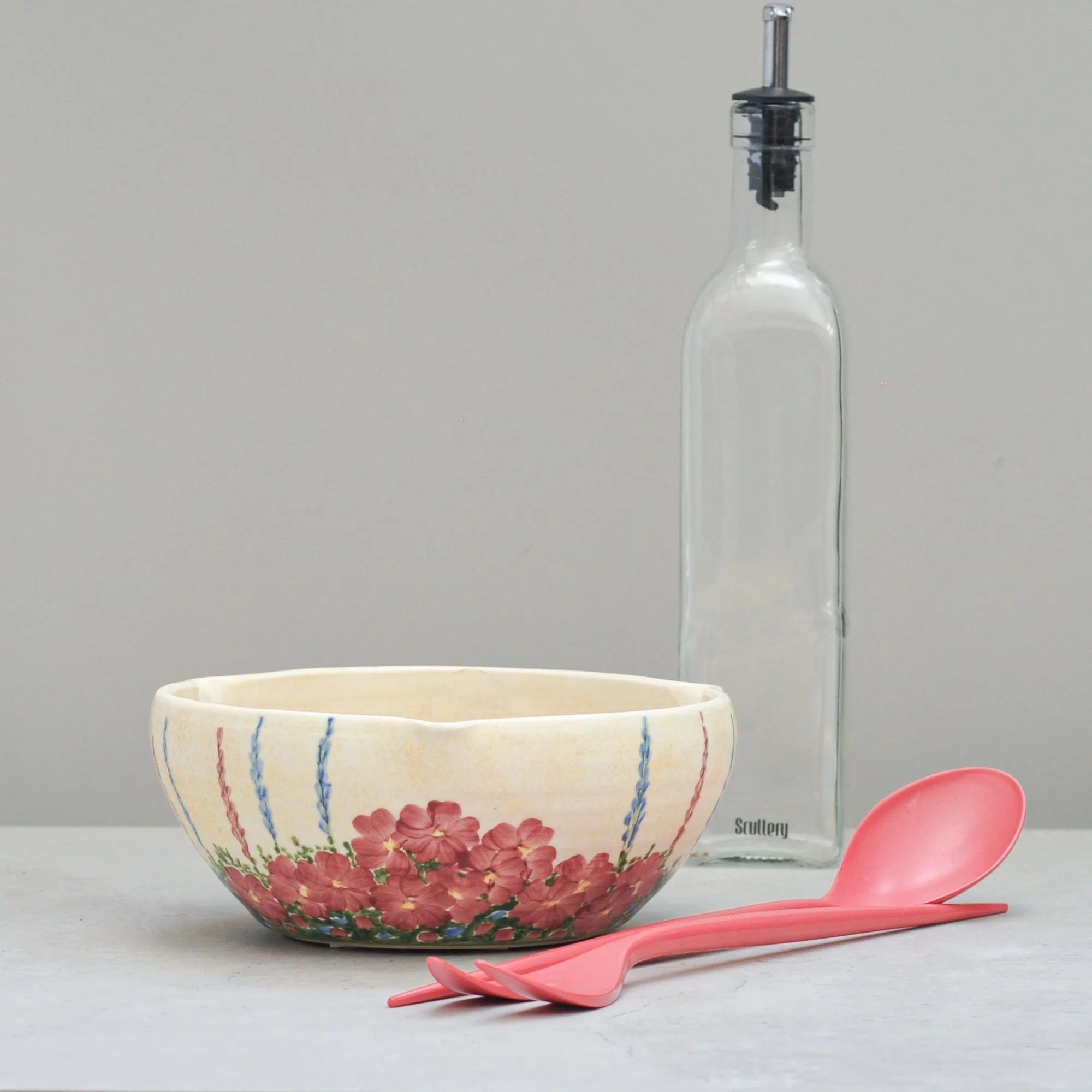 Art Deco E. Radford ceramic mixing bowl styled with kitchen objects for a warm, everyday lifestyle scene.