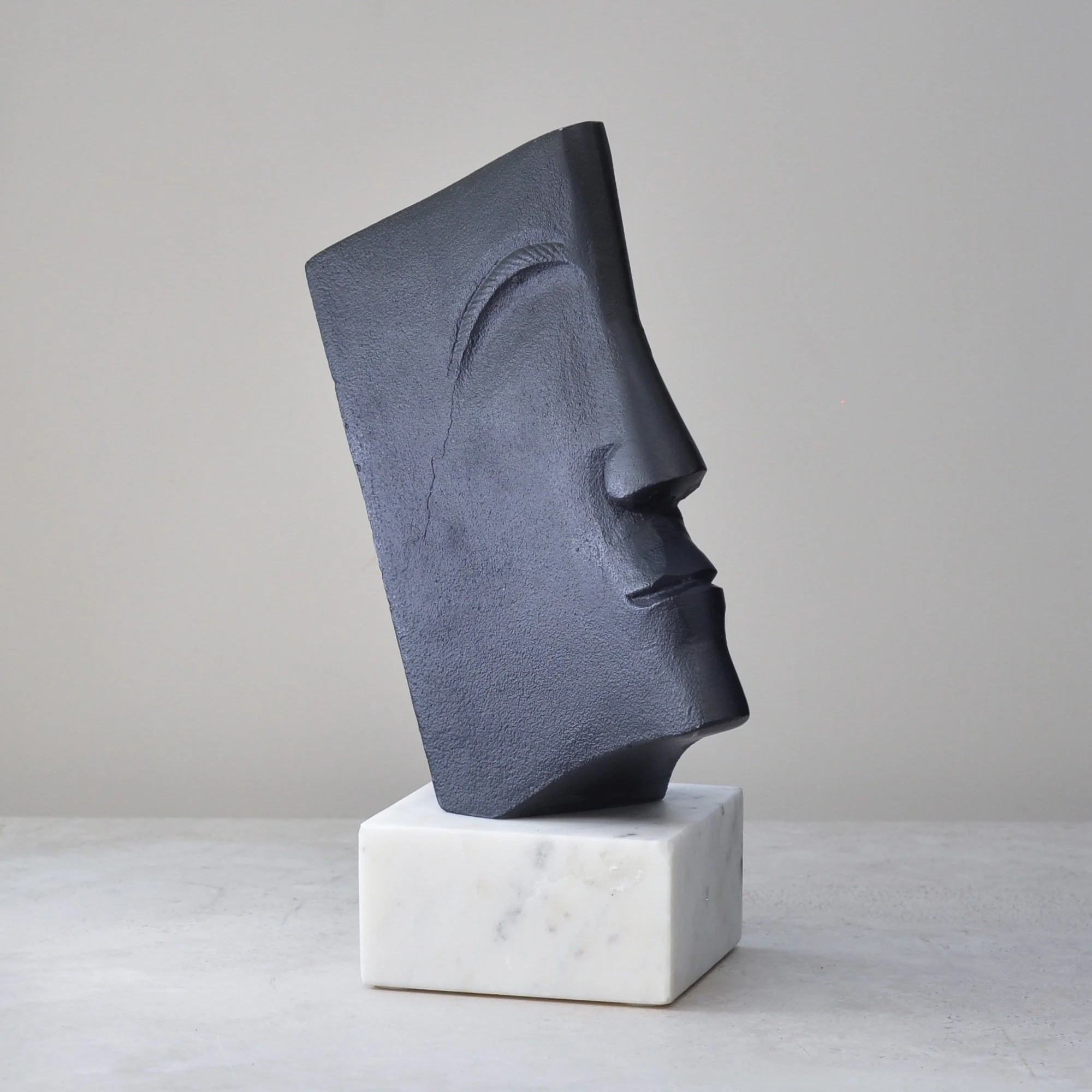 Abstract modernist metal and marble sculpture angled view