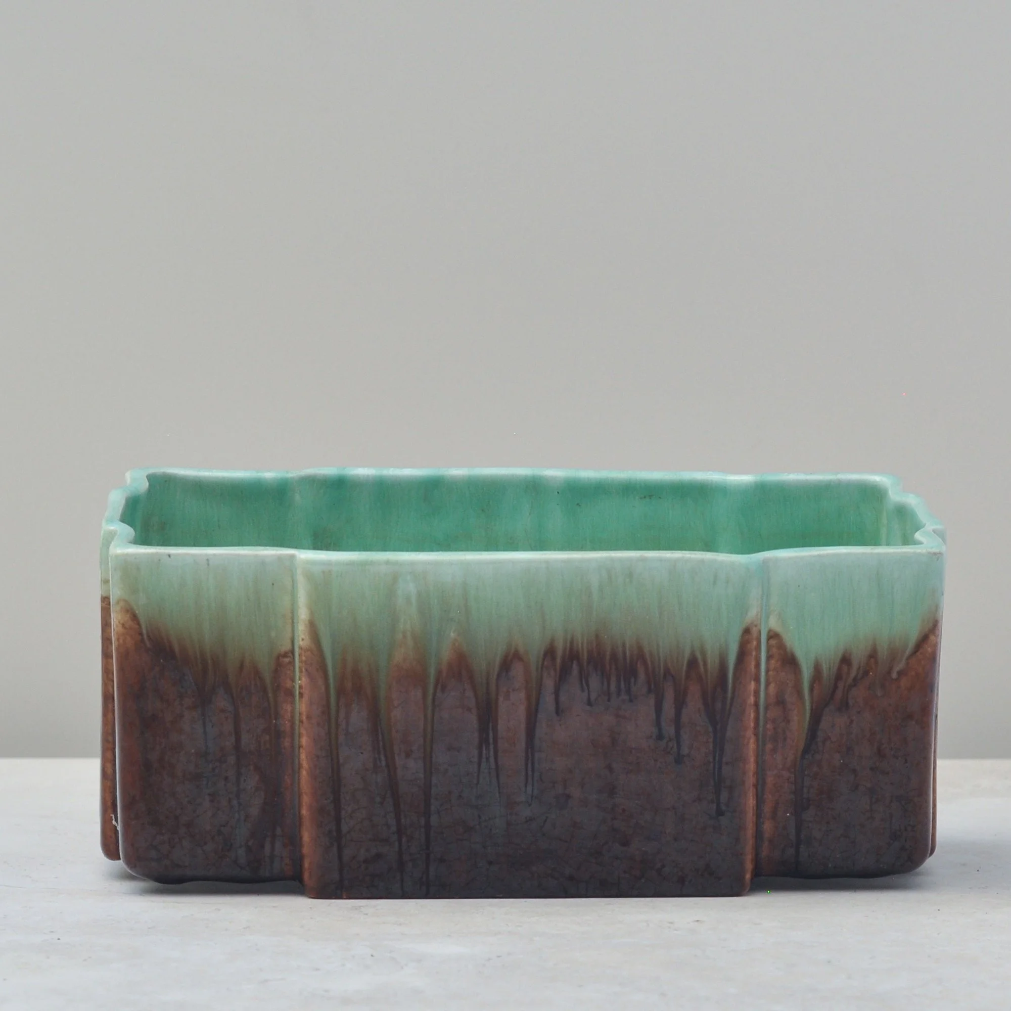 Australian Trent Art Ware ceramic planter showing green and brown drip glaze detail
