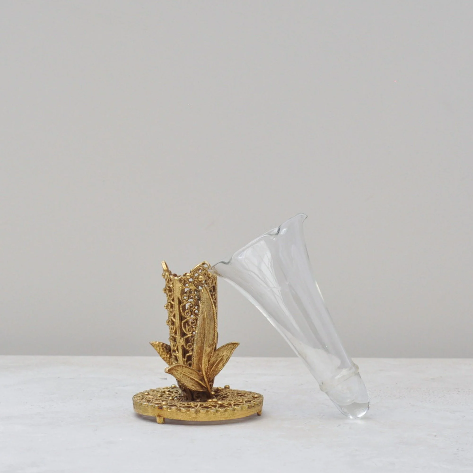 Ruffled glass insert of mid-century filigree bud vase