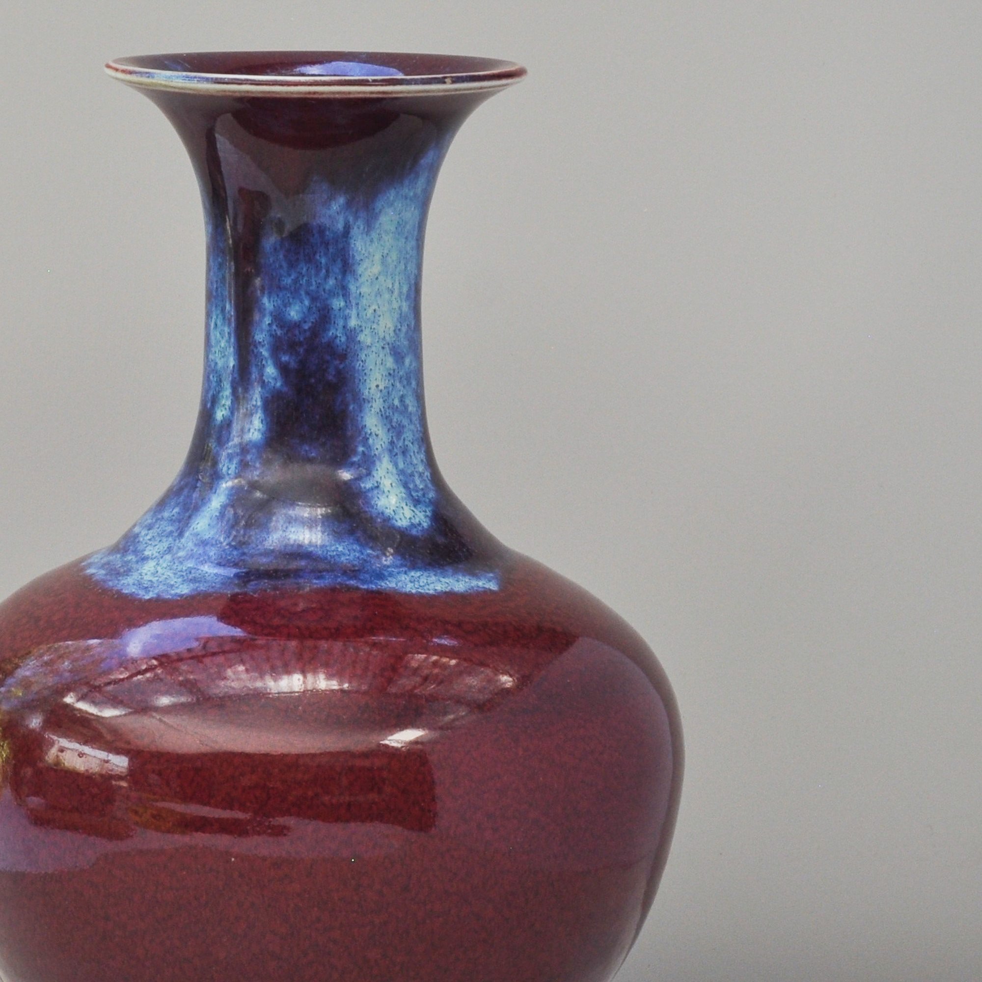 Detail of blue and purple flambe glaze on sang de boeuf porcelain vase