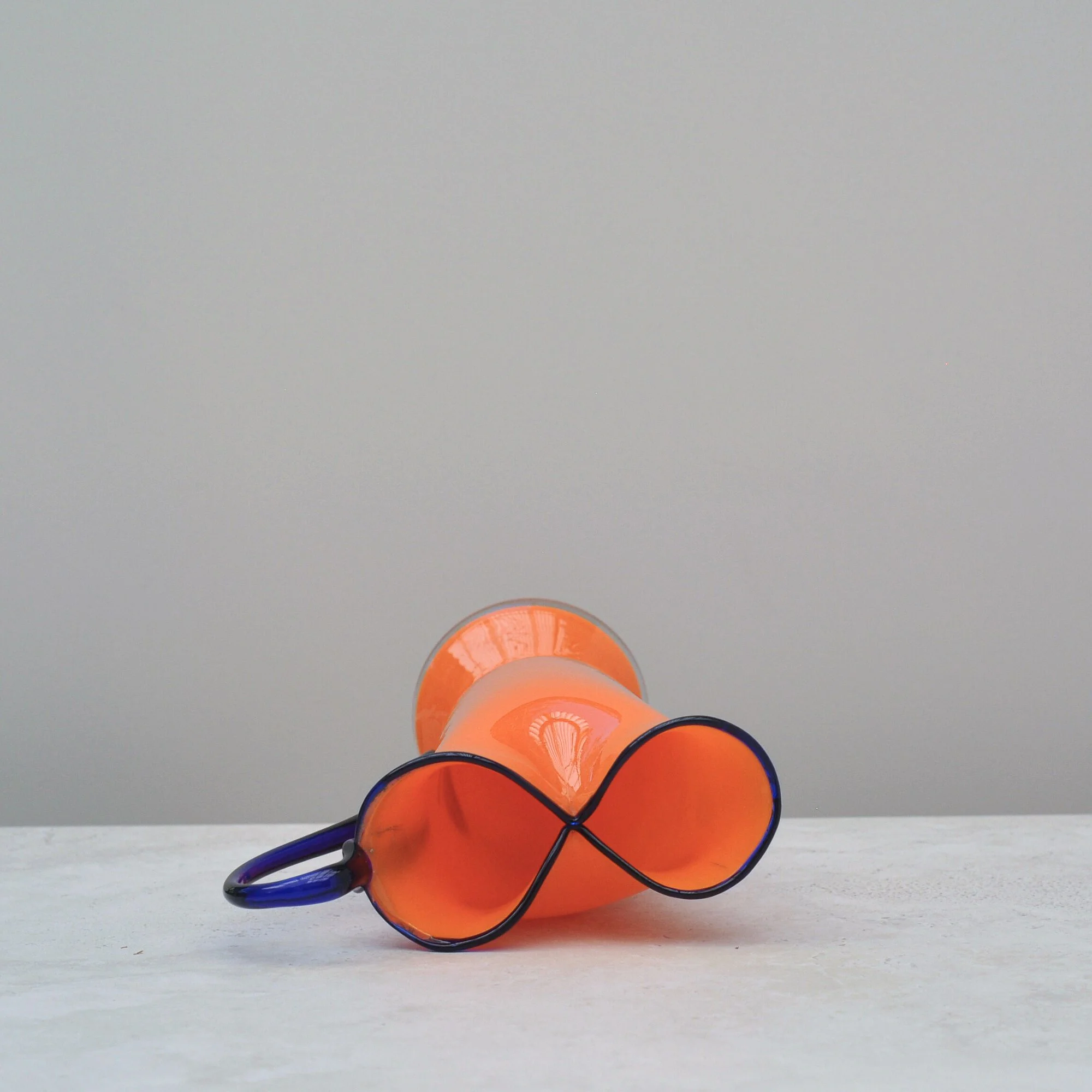 Rim detail of Art Deco Tango Glass jug with orange body and cobalt accents
