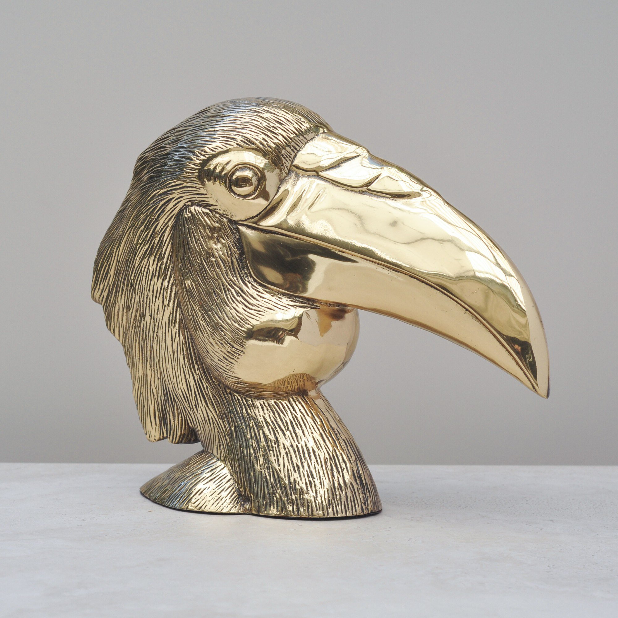 Polished brass bird beak detail on vintage bird head sculpture