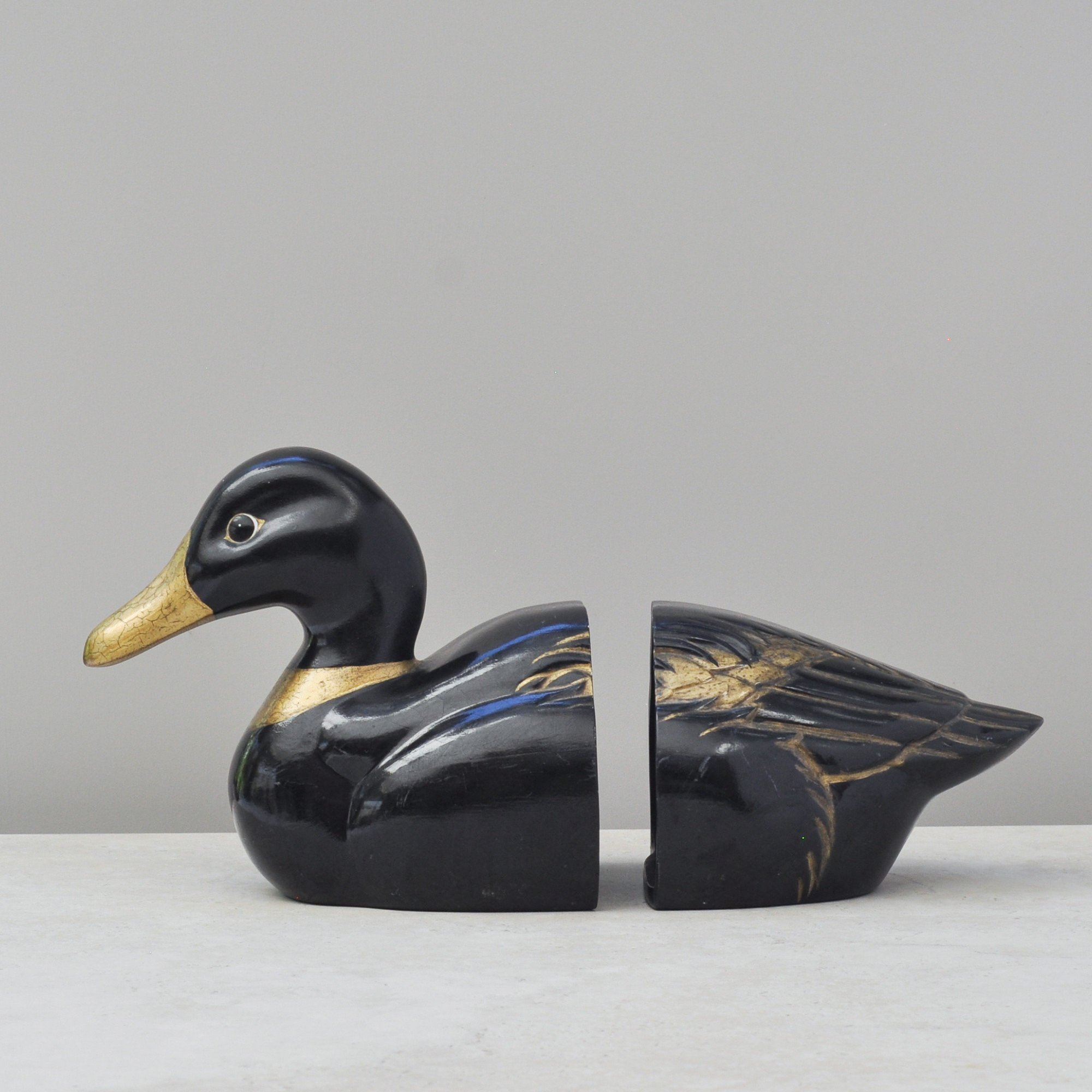 Profile view of studio pottery duck bookend black glaze