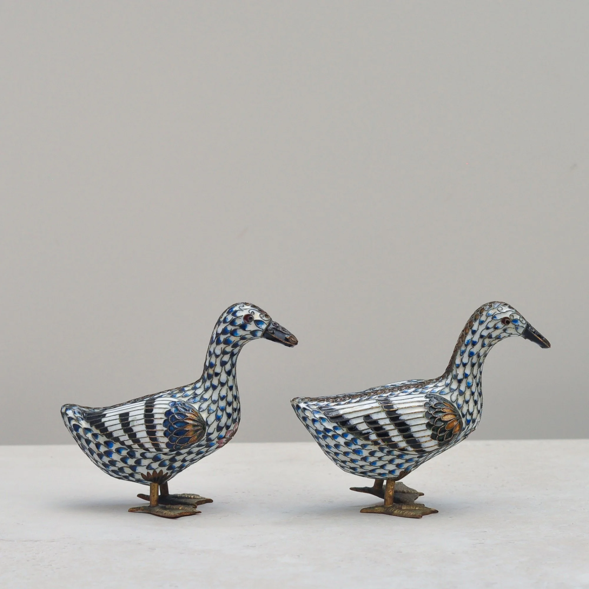 Vintage Chinese cloisonné ducks with blue and white enamel pattern – side profile.