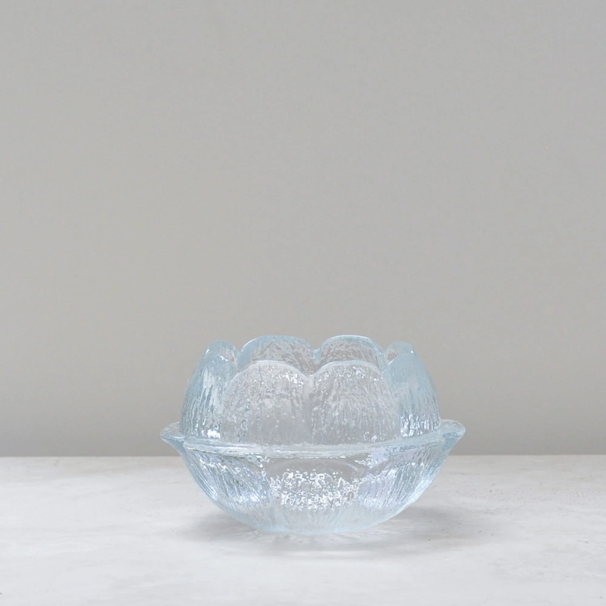 Holmegaard Akande lotus glass candle holder in clear textured glass, Danish mid-century design