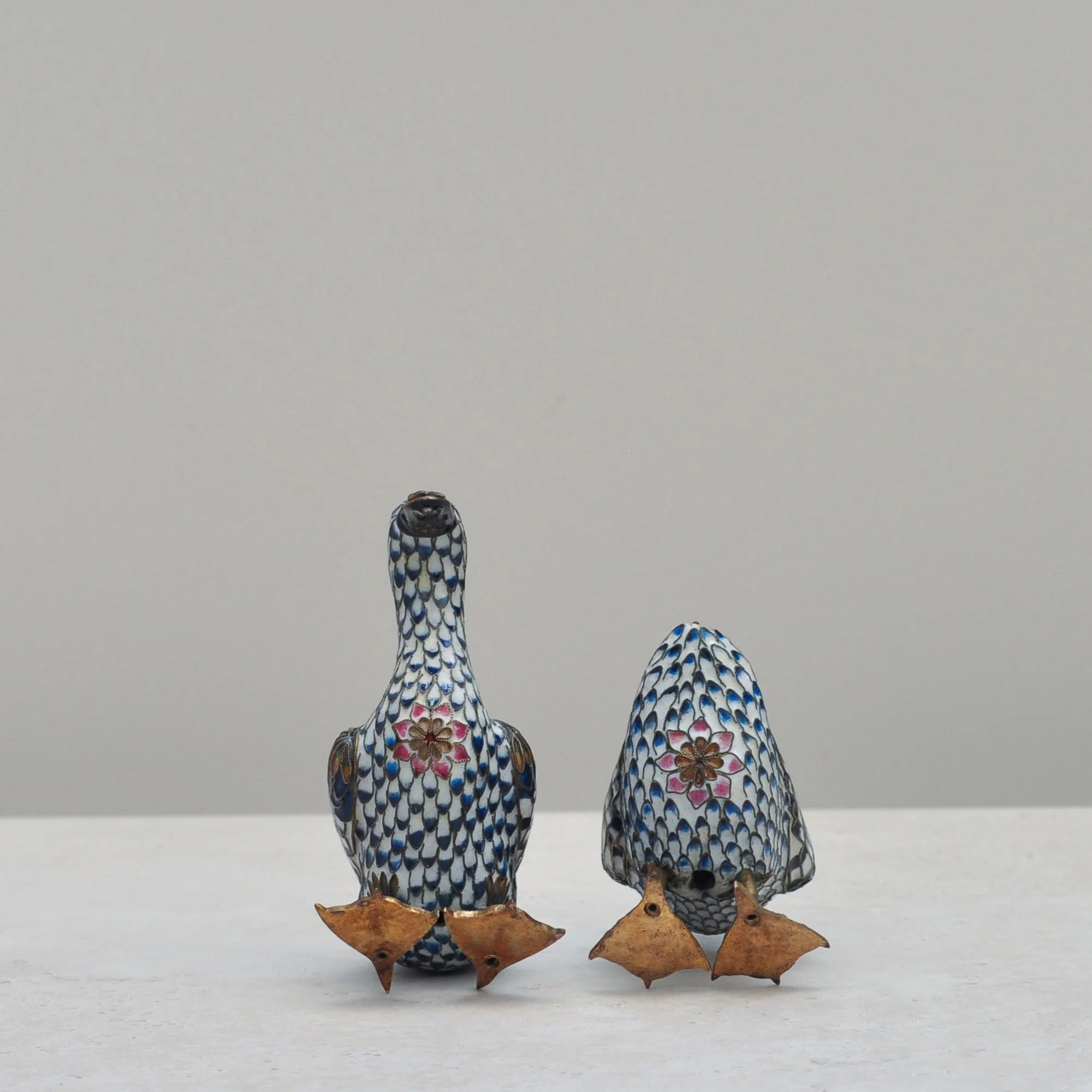 loisonné ducks – back view showing patterned enamel and brass feet.