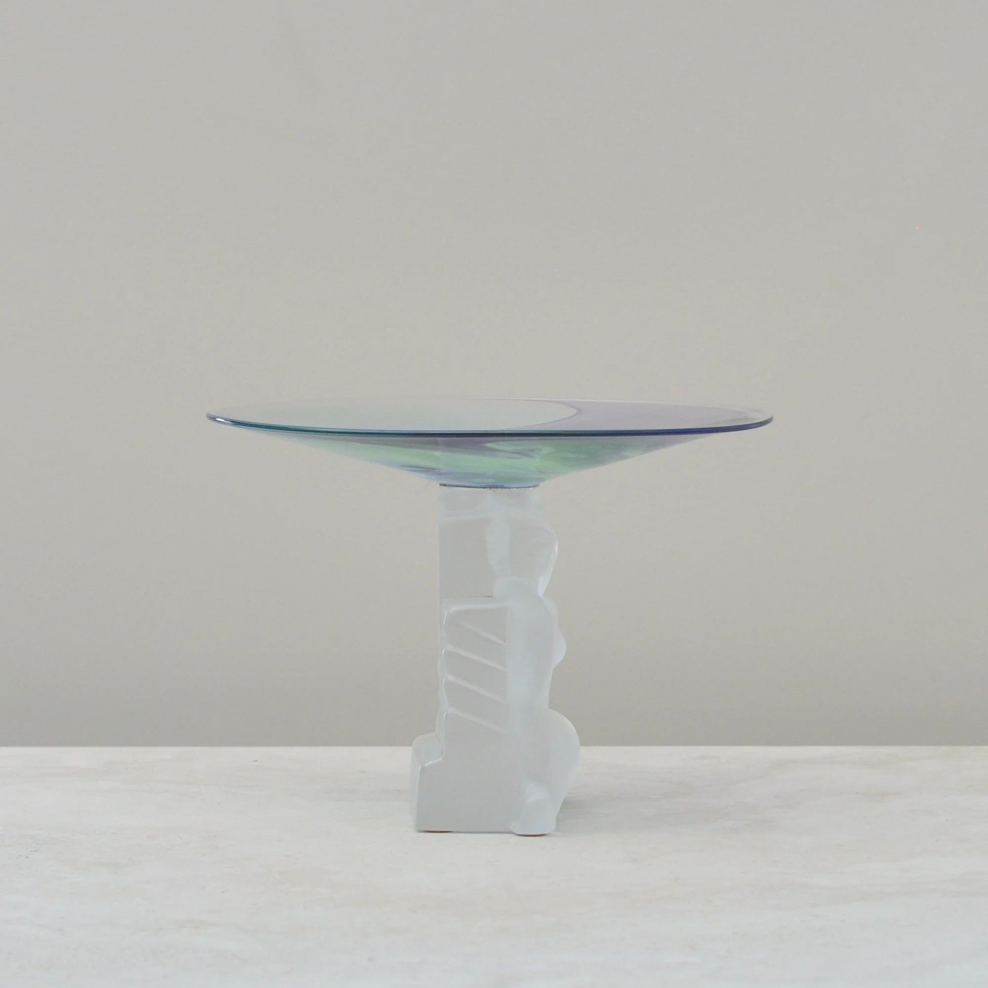 Side profile of the Art Deco inspired frosted lady figure supporting the colourful swirled crystal dish.