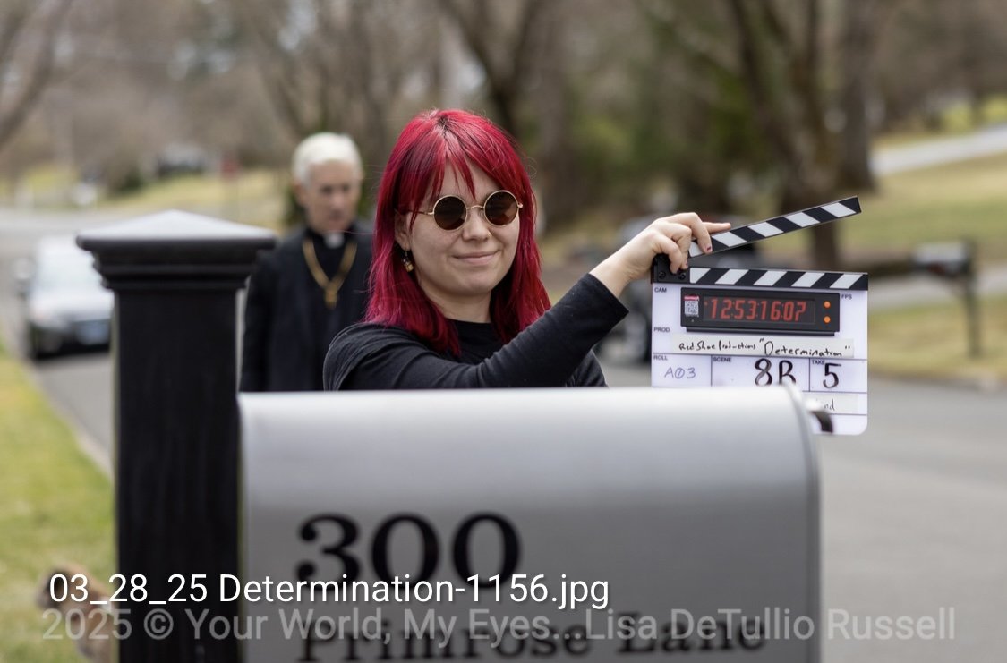 SIT WITH ME WHILE I DIE (2025) Director: Brian Russell / Camera Assistant: Paola Michaela 
Paola working as slate operator. Photo credits: Lisa Detullio Russell