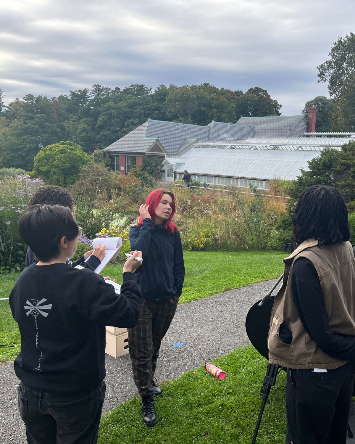 THE WINGED DETECTIVES (2022) Director Paola Michaela going over plans with camera team