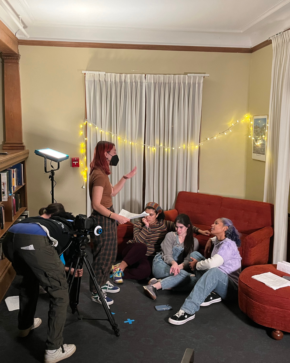 Filmmaker Paola Michaela directing actors on the set of the winged detectives