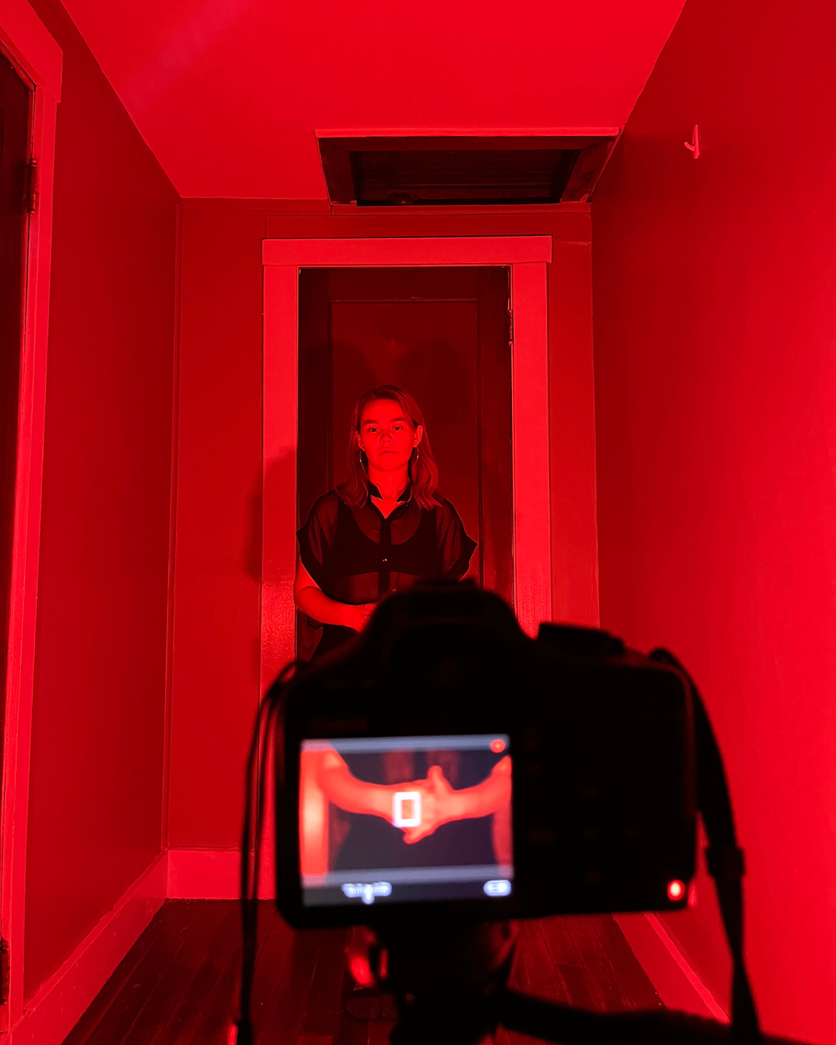 Filmmaker paola michaela directing and acting in hands in front of the camera