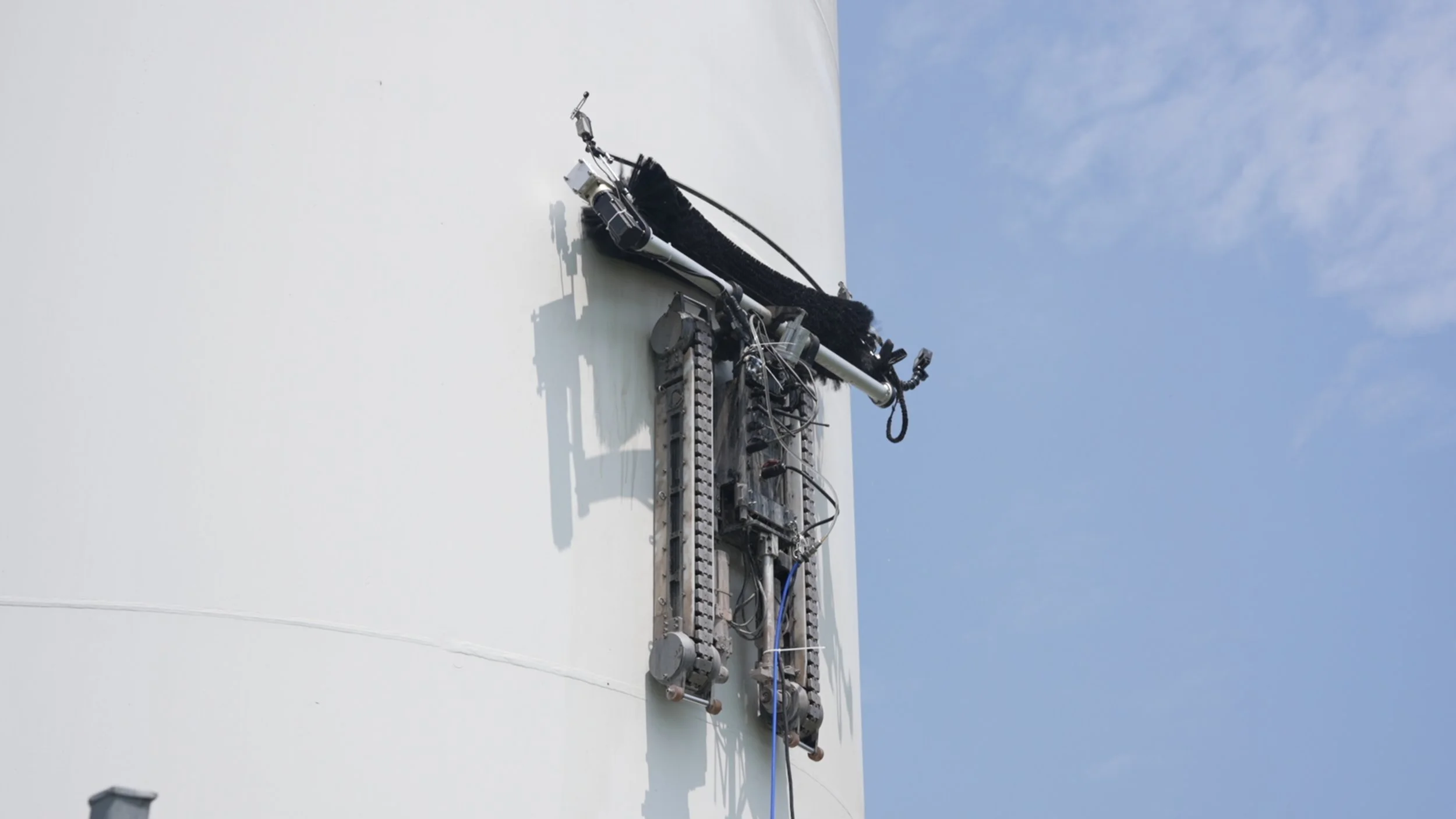 Nighttime view of a tunnel with construction poles and a flashlight or work light on the floor.