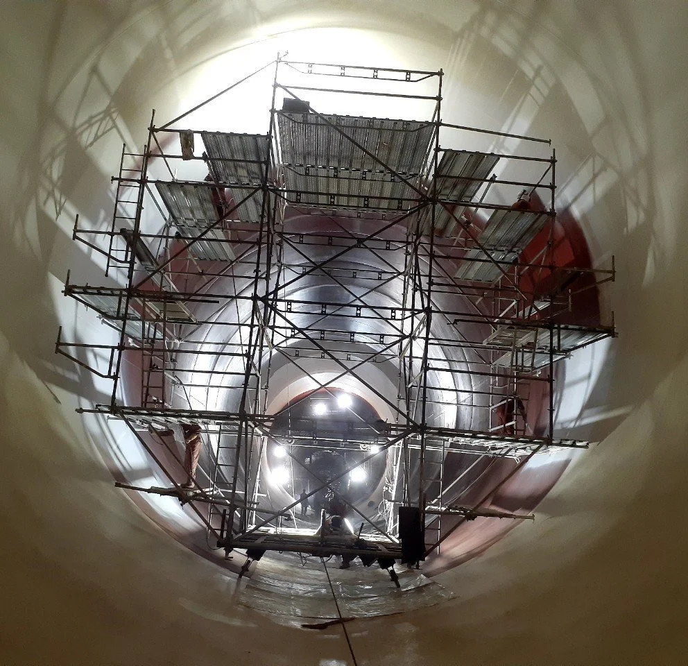 An isometric illustration of four stacked layers or sheets, with the top layer slightly offset.