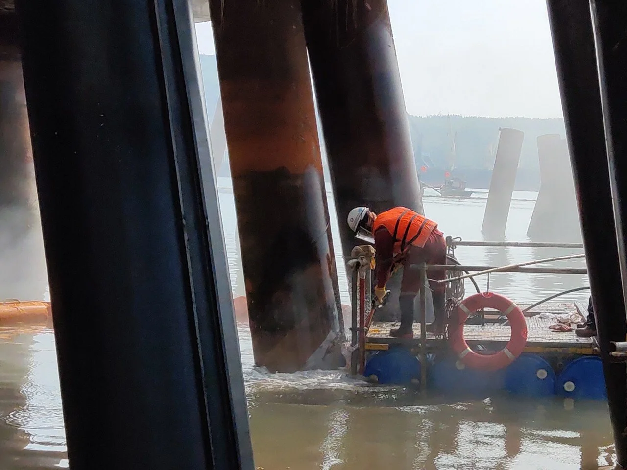 Description: Completed jetty pile protection systems preventing corrosion and extending service life in oil and gas facilities.