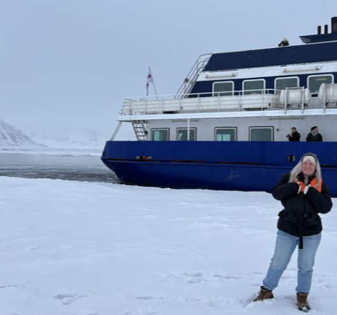 woman-smiling-on-ice-boat-behind.jpg