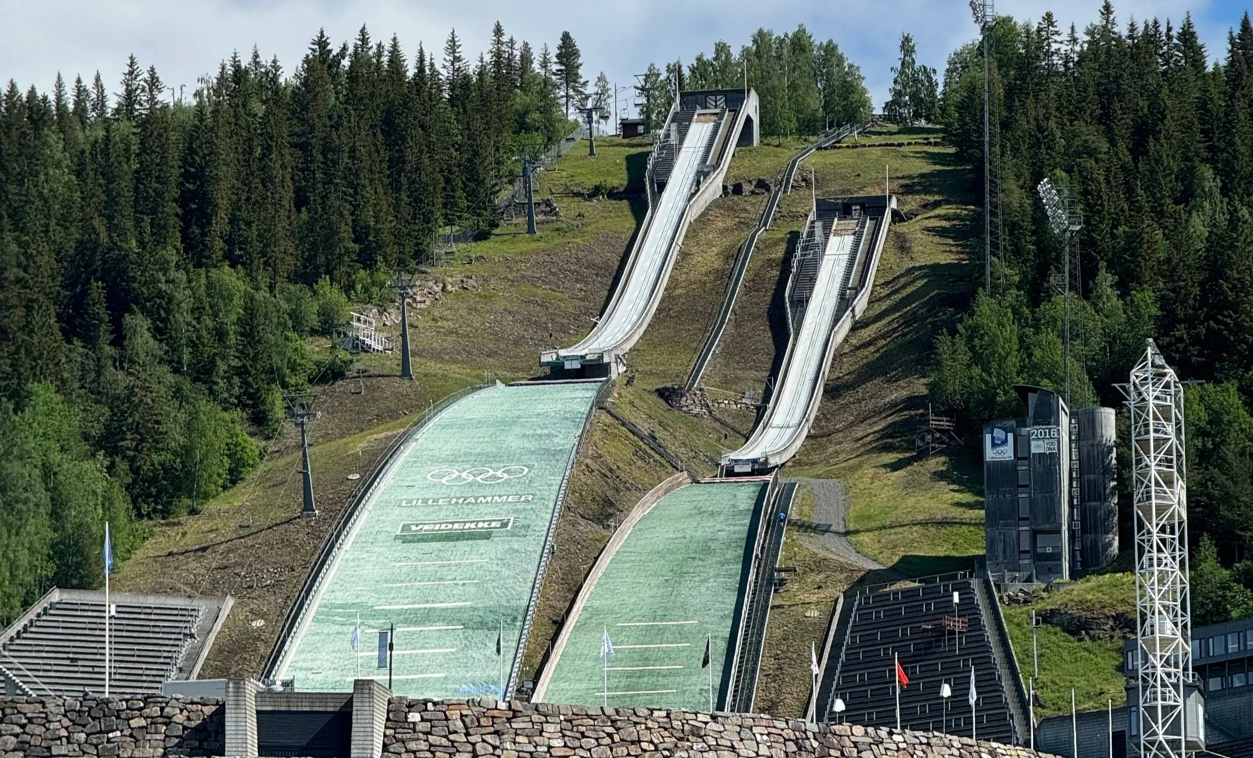 Exterior of the Olympic Museum with slopes in Lillehammer, Norway, with surrounding landscape visible