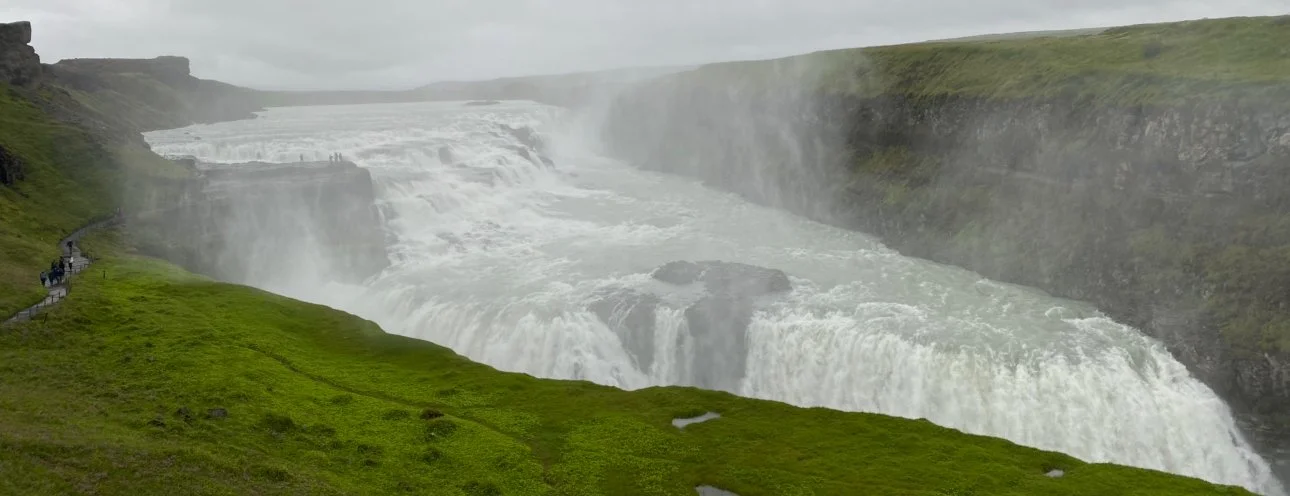 The powerful Gullfoss waterfall in Iceland cascading into a rugged canyon.