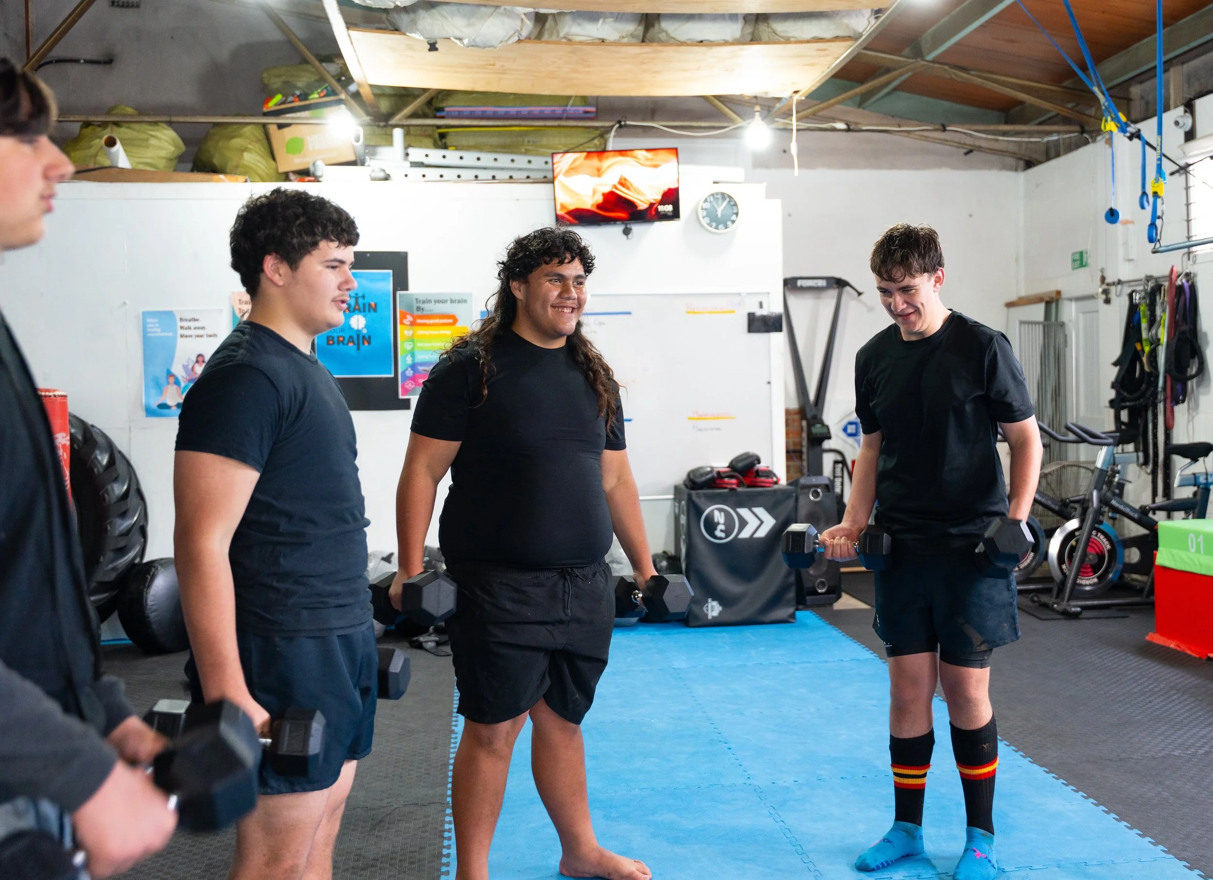 Boys bicep curls smiling.jpg