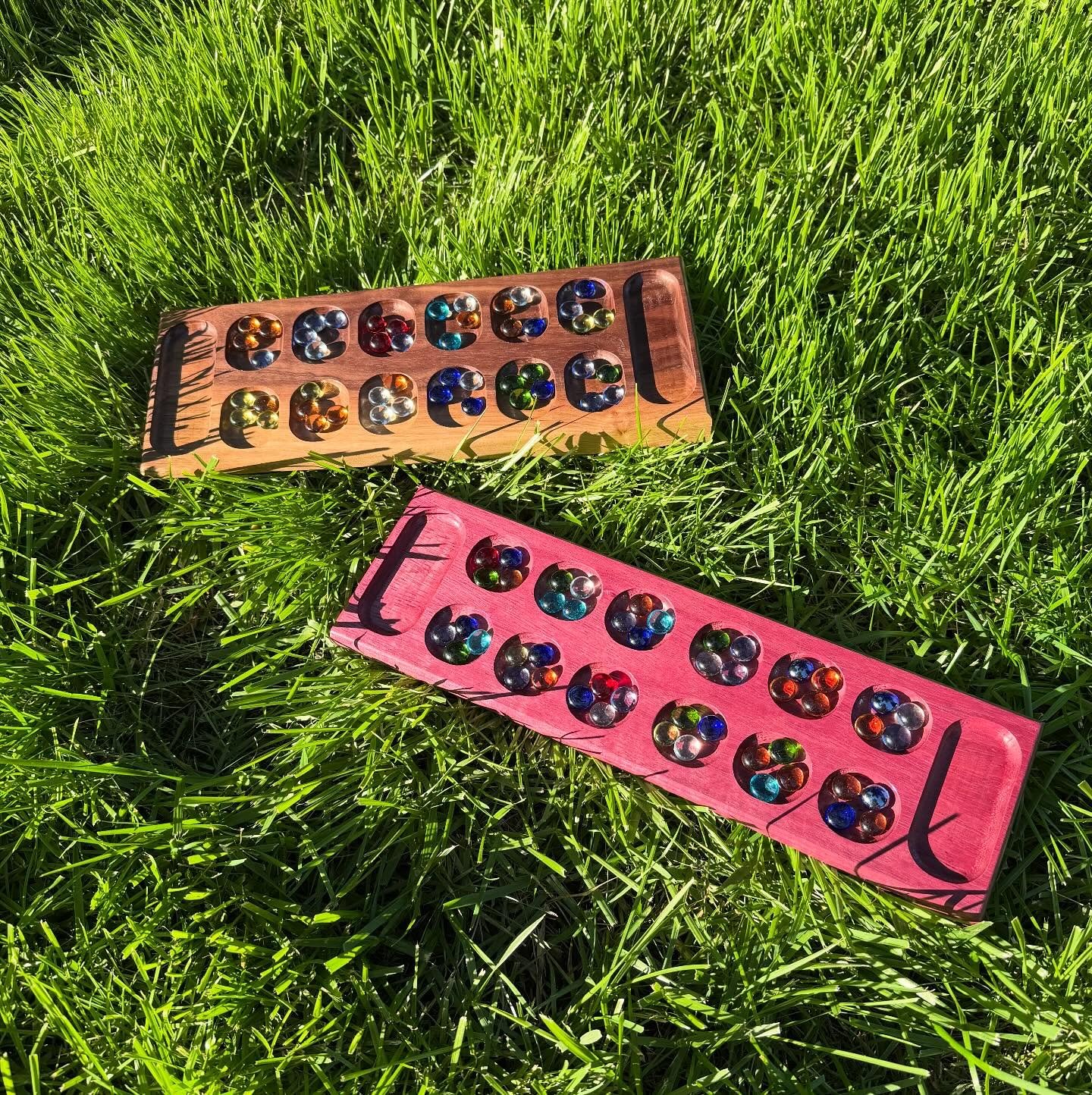 Check out these two Mancala boards I crafted - one in stunning Purple Heart and the other in gorgeous Walnut!