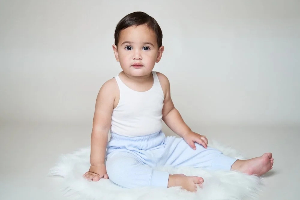 Light-filled childcare portrait in Sydney capturing a genuine smile and playful expression.