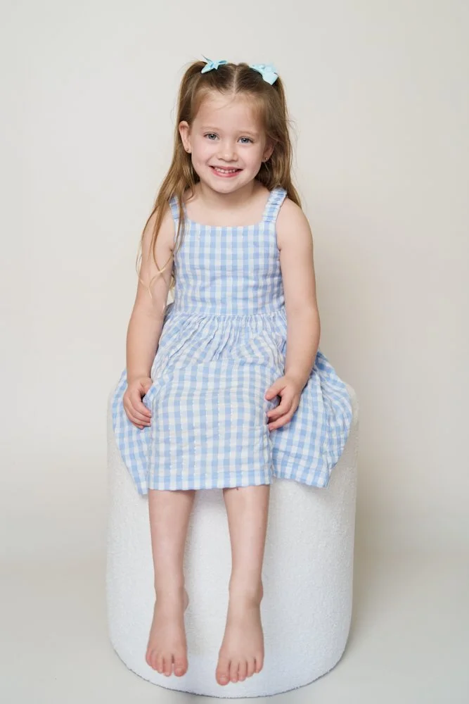 Light-filled childcare portrait in Sydney capturing a genuine smile and playful expression.