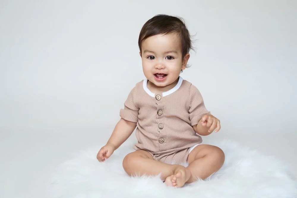 Light-filled childcare portrait in Sydney capturing a genuine smile and playful expression.