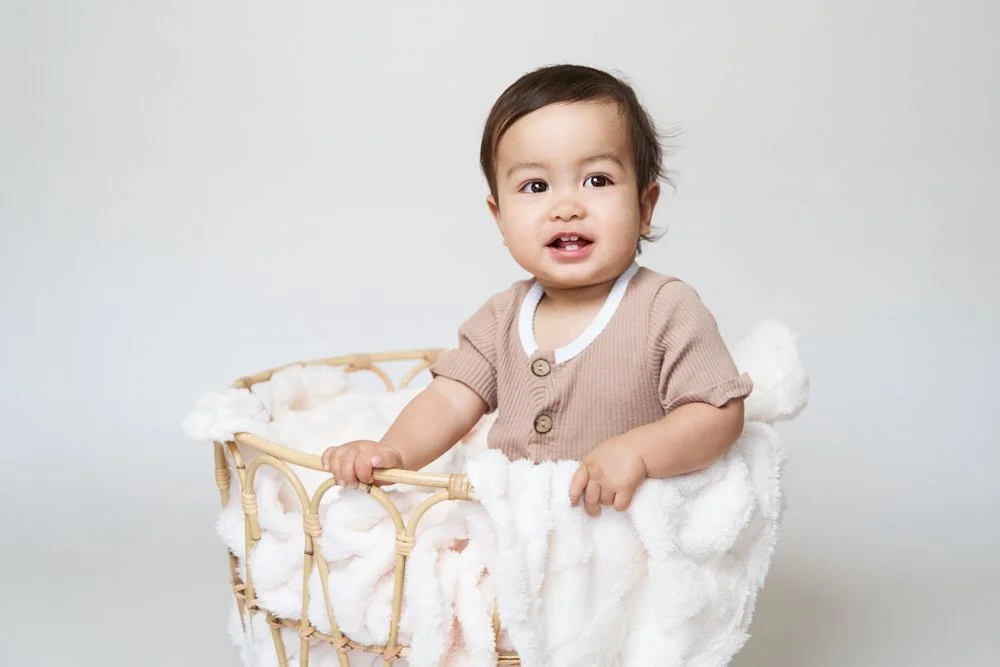 Light-filled childcare portrait in Sydney capturing a genuine smile and playful expression.