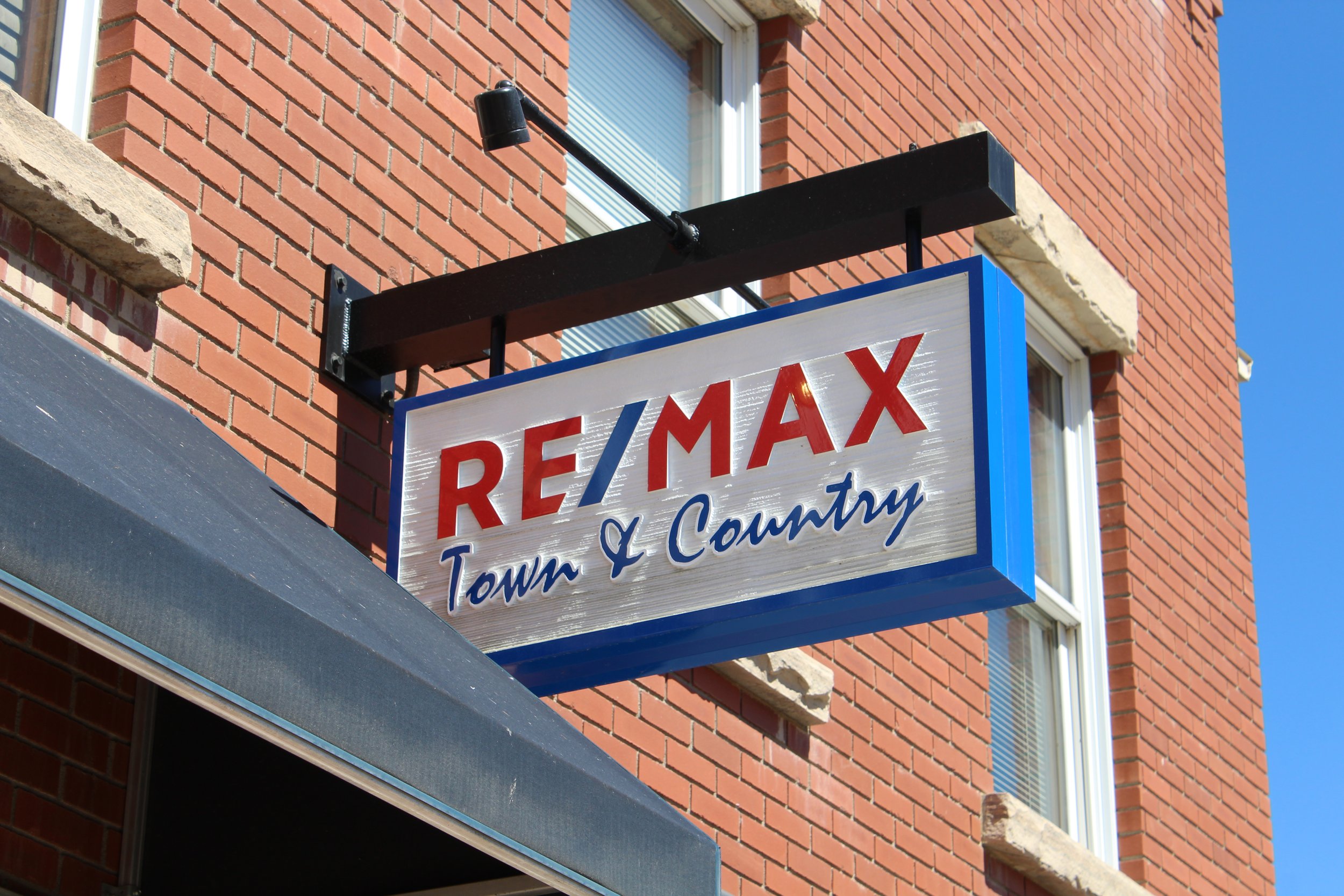 The sign over the door to RE/Max Town and Country in Berthoud, Colorado, where Lori Symmes is a Realtor