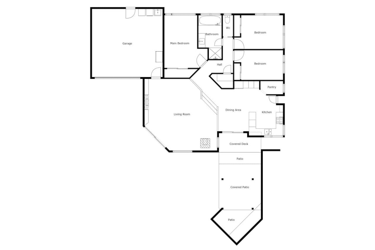 Floor plan of a house with labeled rooms including garage, main bedroom, bathrooms, two additional bedrooms, pantry, kitchen, dining area, living room, covered deck, patio areas, and multiple patios.