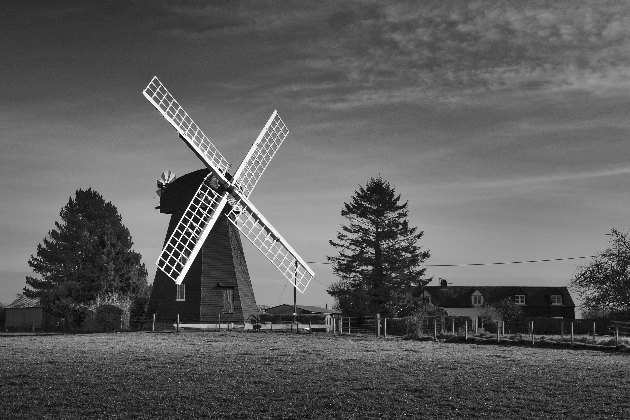 Lacey Green Windmill, Chiltern Hills, Buckinghamshire
Lacey Green Windmill stands against a cloud-streaked winter sky, Chiltern Hills, Buckinghamshire. One of the oldest surviving smock mills in England, its white sails cut a bold cross against the g