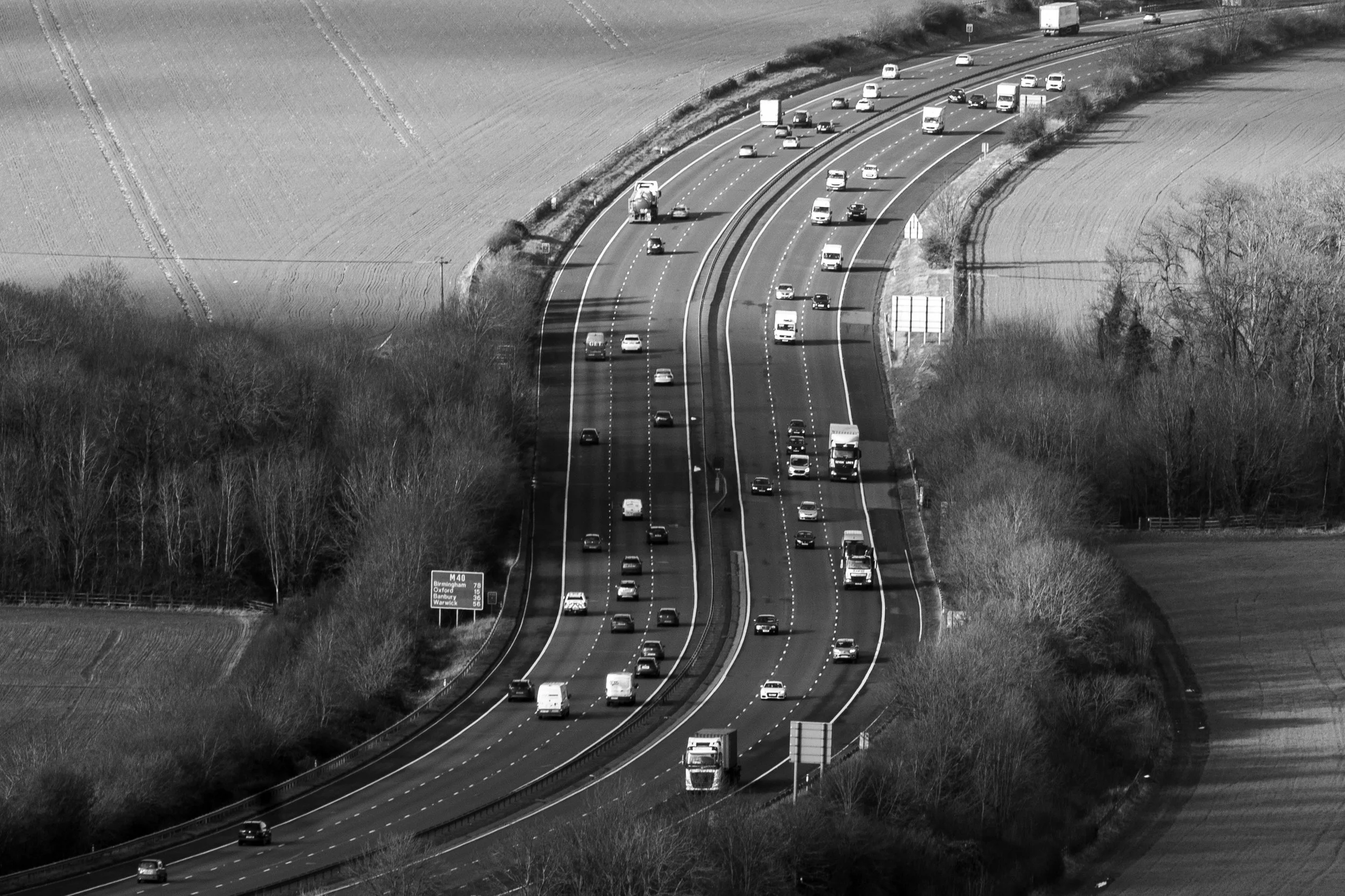 Aerial view of the M40 motorway cutting through the Chiltern Hills landscape at Aston Rowant, Oxfordshire