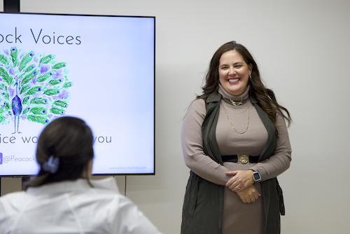 Portrait of Margaret, co-founder of Peacock Voices, representing expert vocal coaching for confident pitching, leadership communication, and professional presence