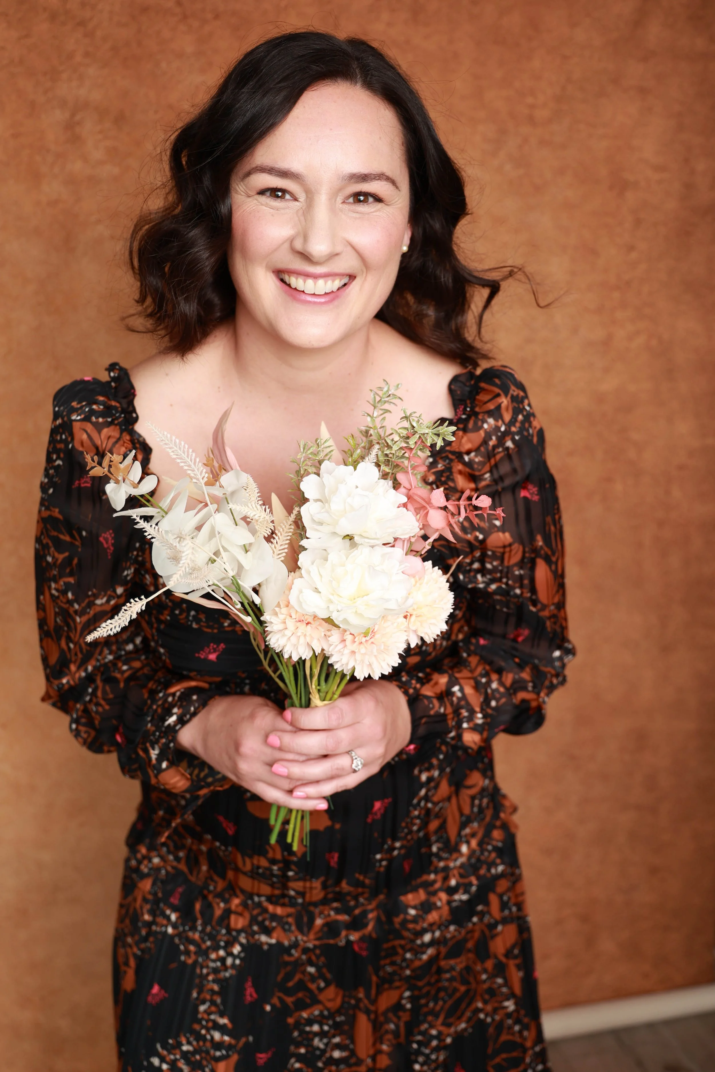 Jen Thibault holding bouquet of flowers