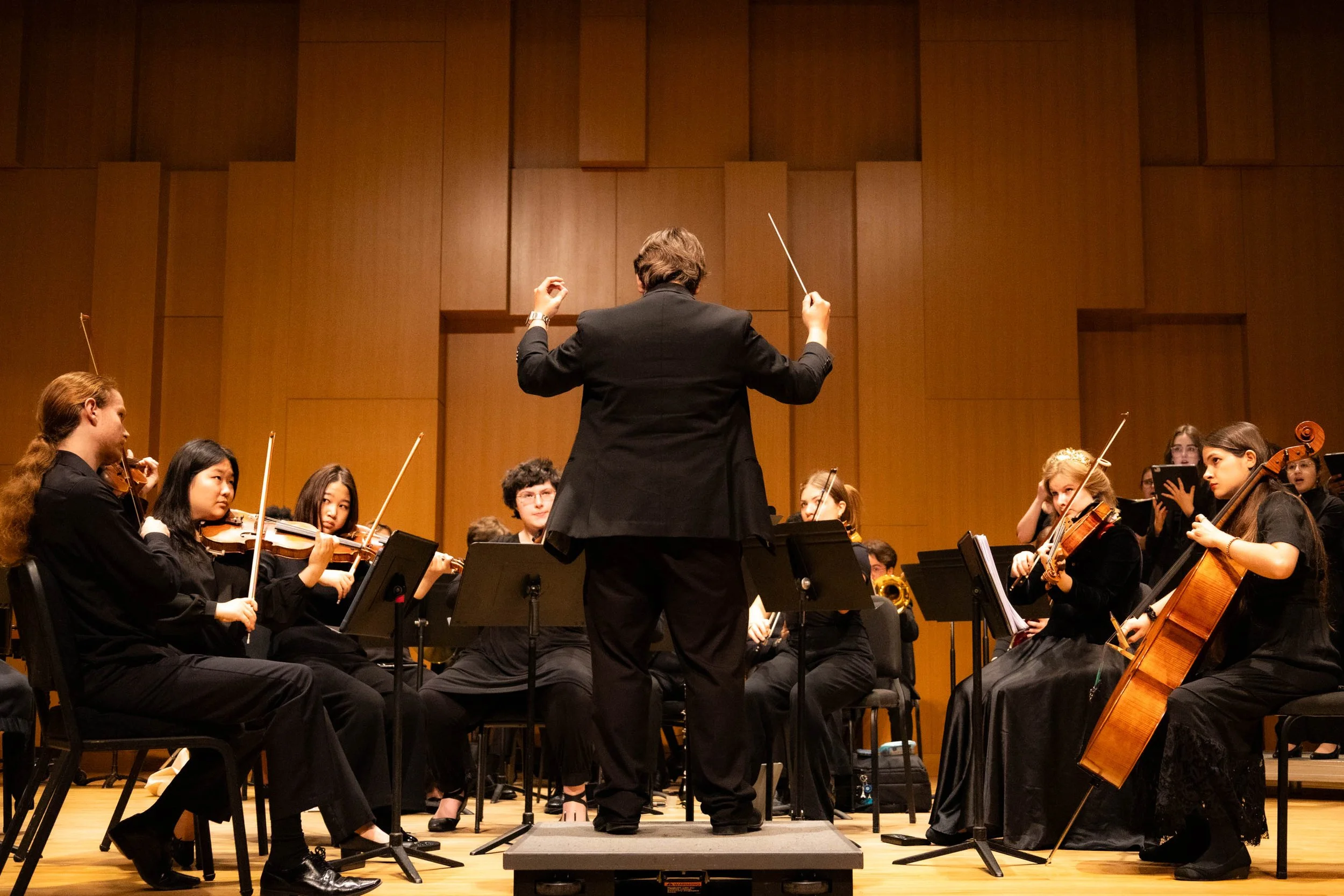 Huffman conducts the ensemble as they play Variations on A Dream, a concerto Huffman co-wrote with fellow composition juniors Jilin Zhang and Demetrius Robinson Jr. The concerto started out as a fun passion project titled "Collab of the Century."