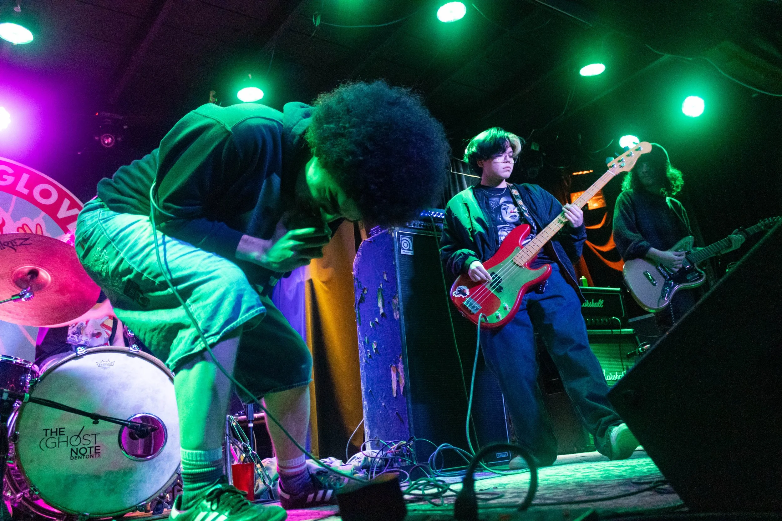 Houston, Demello, and Coxon play "hindenburg" to a small crowd inside Rubber Gloves Rehearsal Studio.