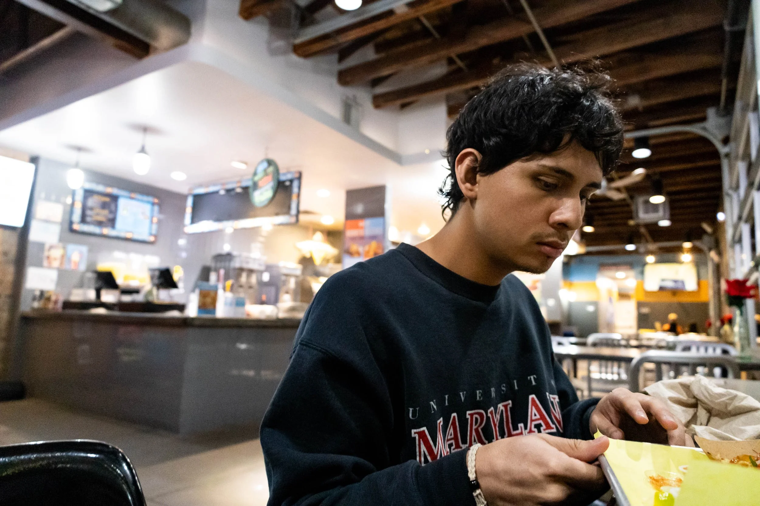 Right before Rusty Taco closes, Denton resident Mateo Gutierrez cleans up his dinner from the evening.