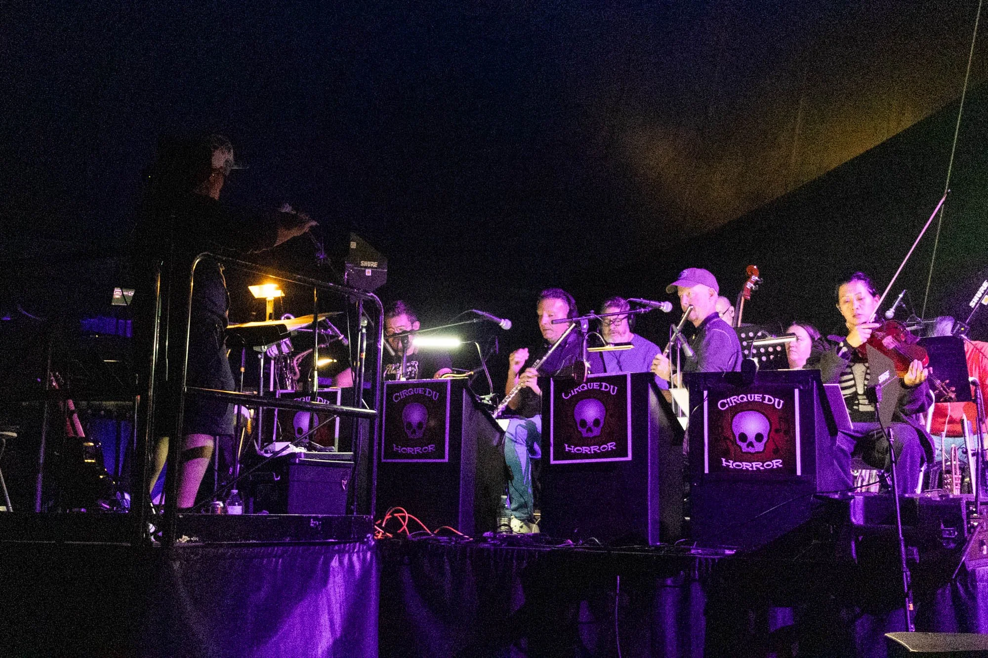 The Orchestra of the Undead practices a song before the dress rehearsal starts. Violinist Roni Gan and Reed player David Monsch are visible.