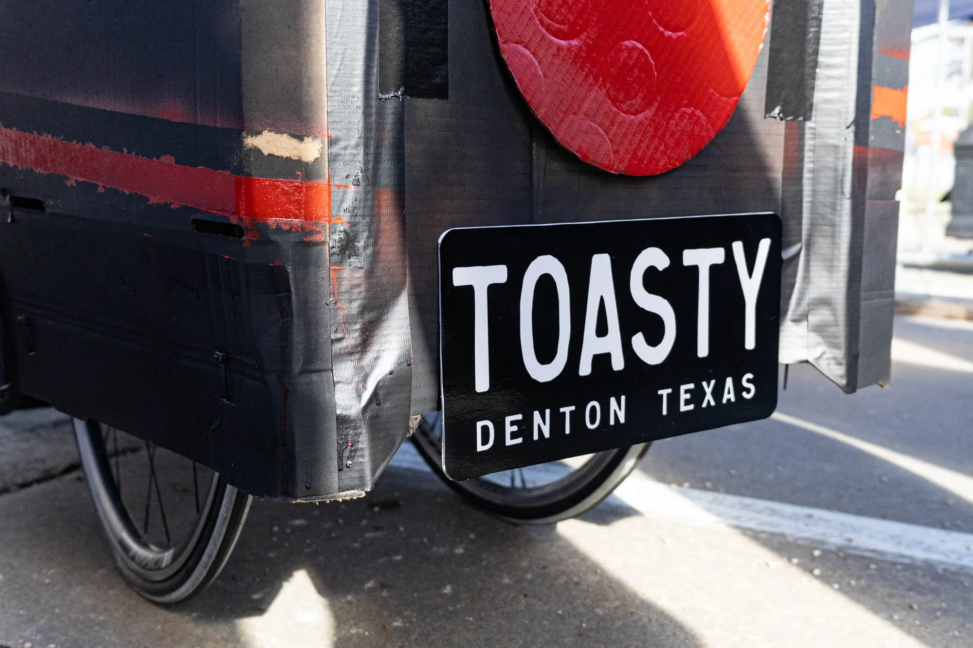 The Toaster Coaster matched Toast and Gilley's costumes for the festival as Batman and Robin, including the Toasty Bros license plate.
