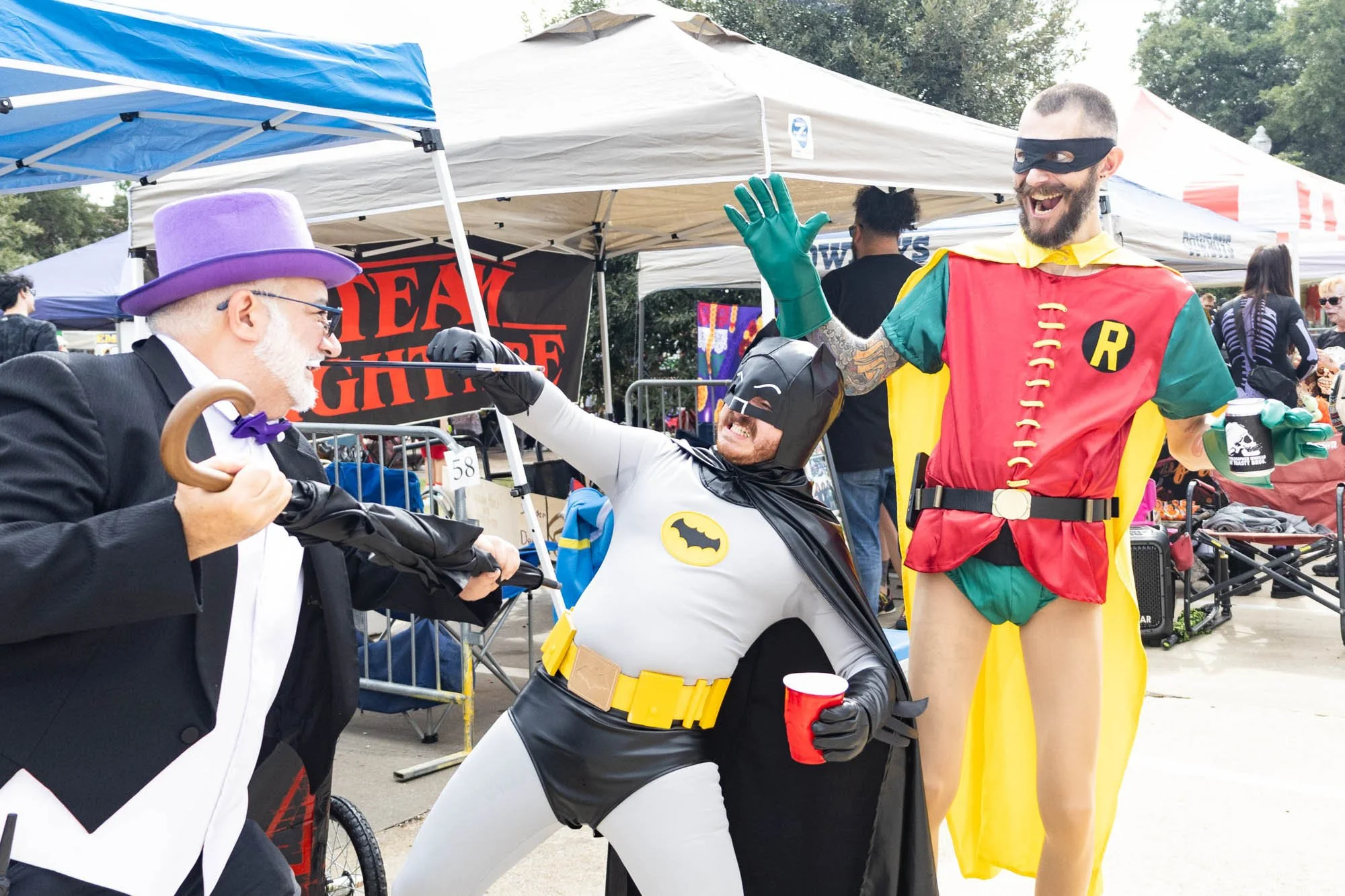 Toast and Gilley pose for a photo with friend Saul Sepulveda dressed as The Penguin. The Toasty Bros. costumes were based on the 1966 Batman movie with Adam West.