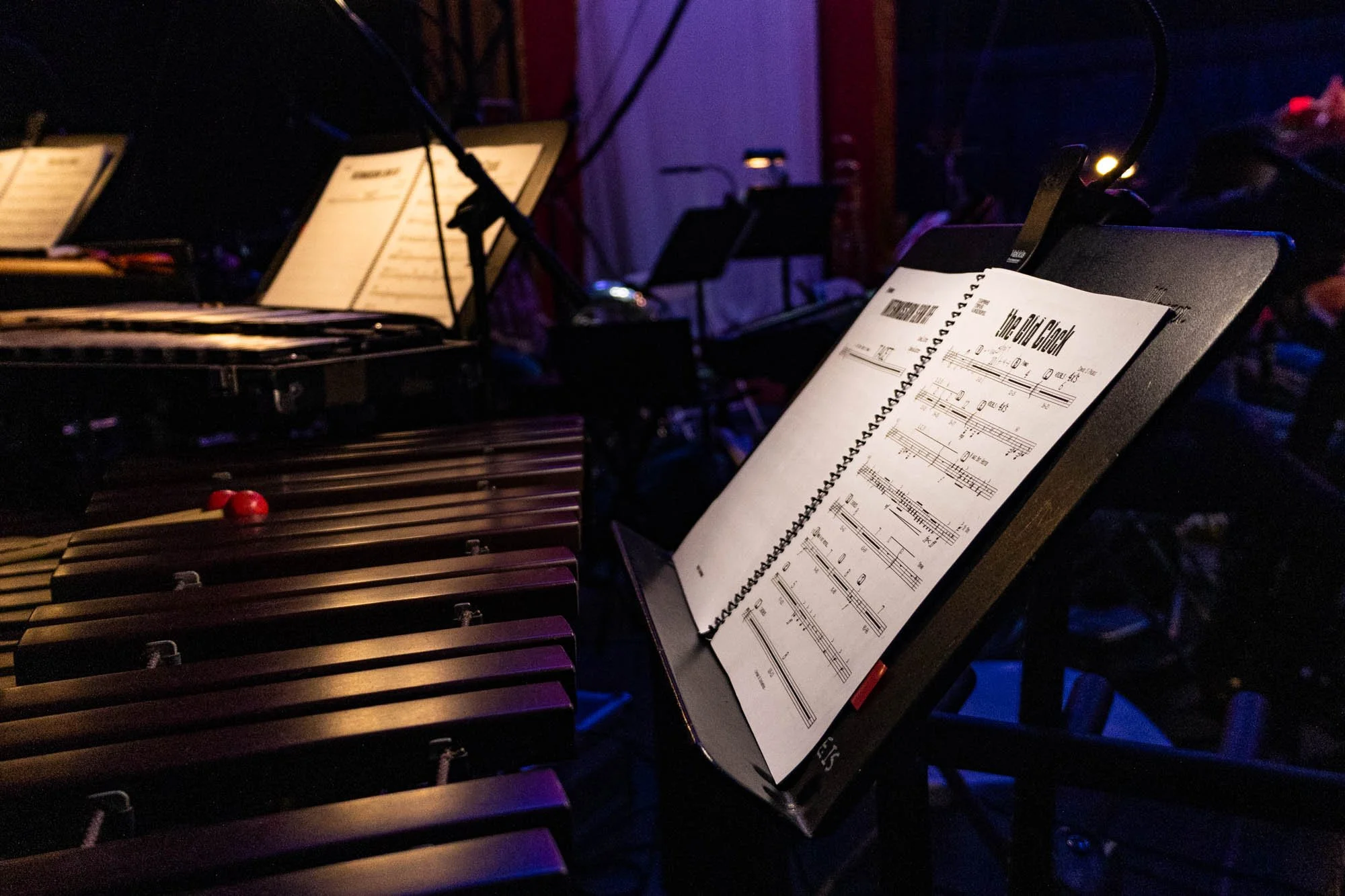 Sheet music for the song "The Old Clock," composed by Pierce, sits on a music stand in front of the marimba, played by Megan von Dreau.