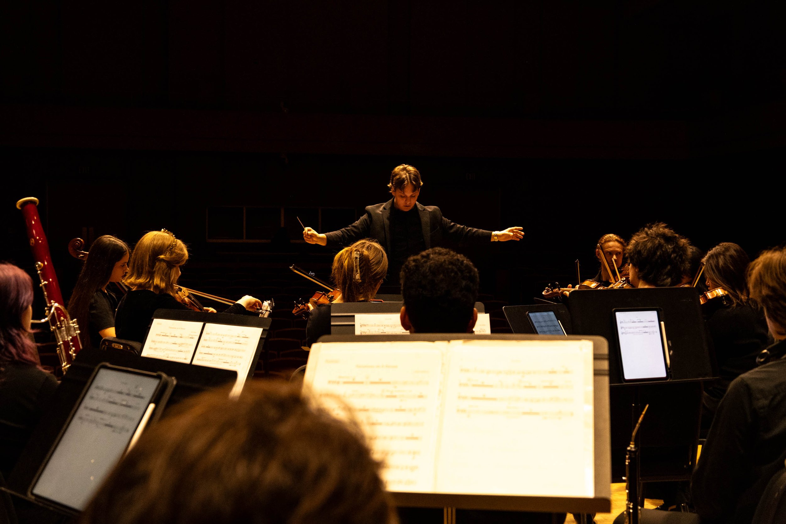 Dream Sequence no.1 - In the Paul Voertman Music Hall, Music Composition junior Collin Huffman conducts the ensemble into a crescendo during dress rehearsal. Huffman co-wrote this concerto, titled Variations on A Dream, with fellow junior music compo