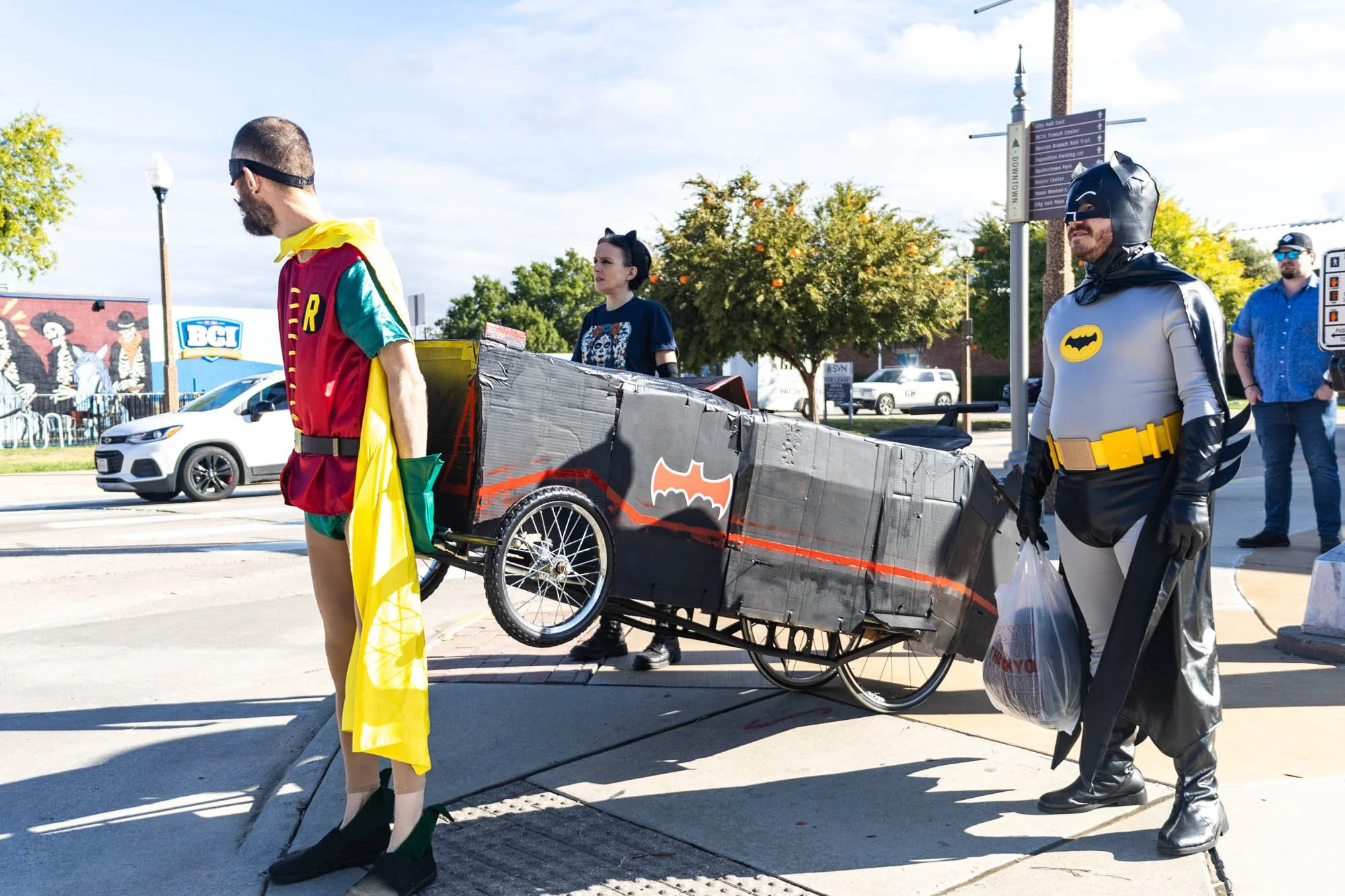 Standing on the corner of E Bell Ave. and Hickory St., Toast, his partner Leah Jordan, and Gilley walk the coffin to their designated spot at the festival.