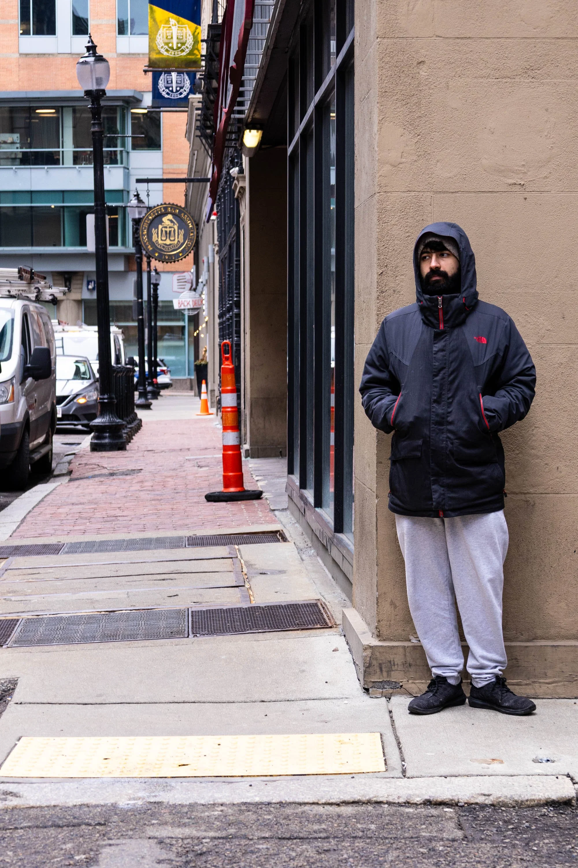 Taking a Ten  𖦹  On West Street, a man stands outside of his job on a smoke break despite the cold weather conditions. He worked a block from Boston Commons, a sprawling park located in the center of the city.