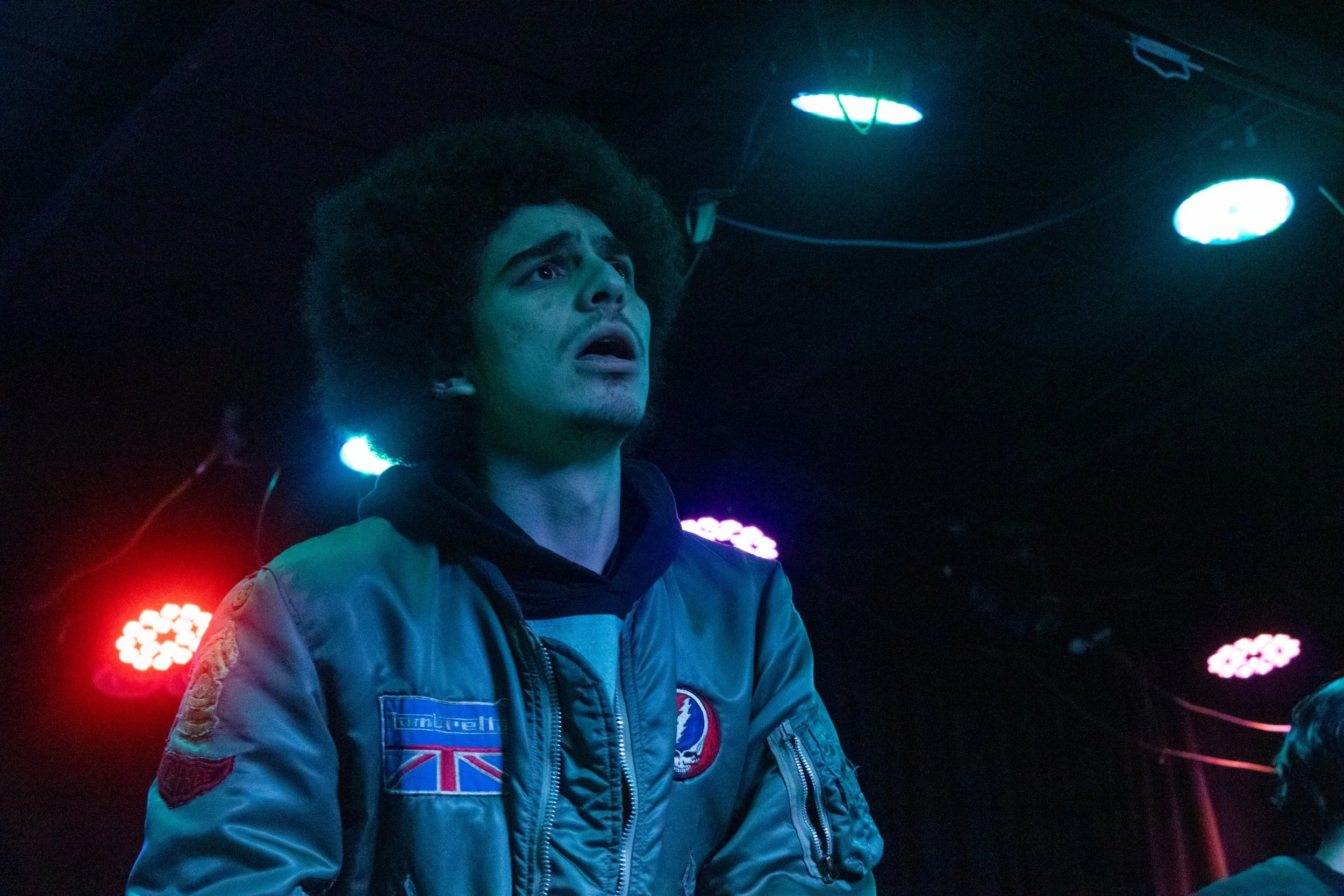 Houston looks out over the crowd during their song "disk drive."